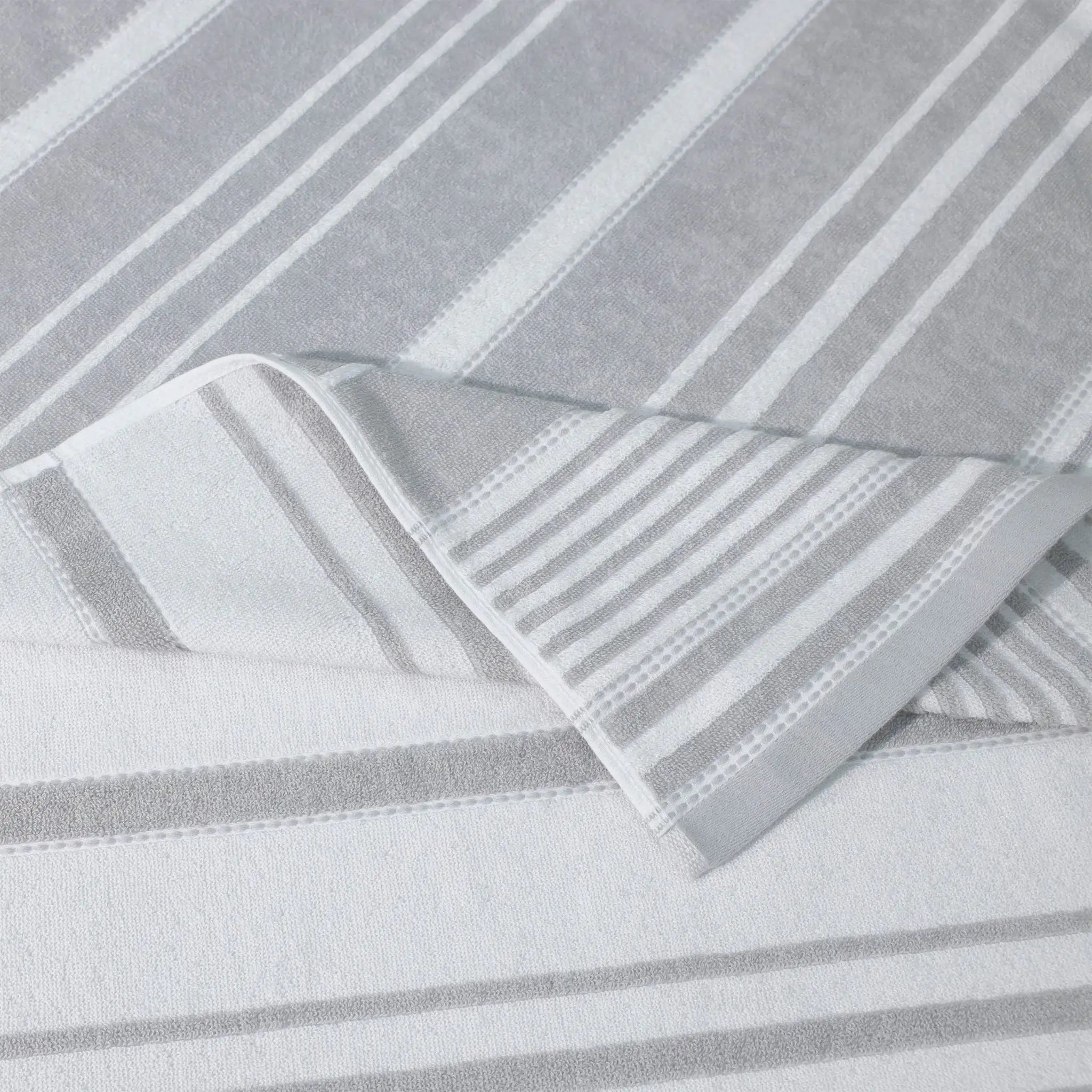 Close-up of gray striped fabric with a folded corner