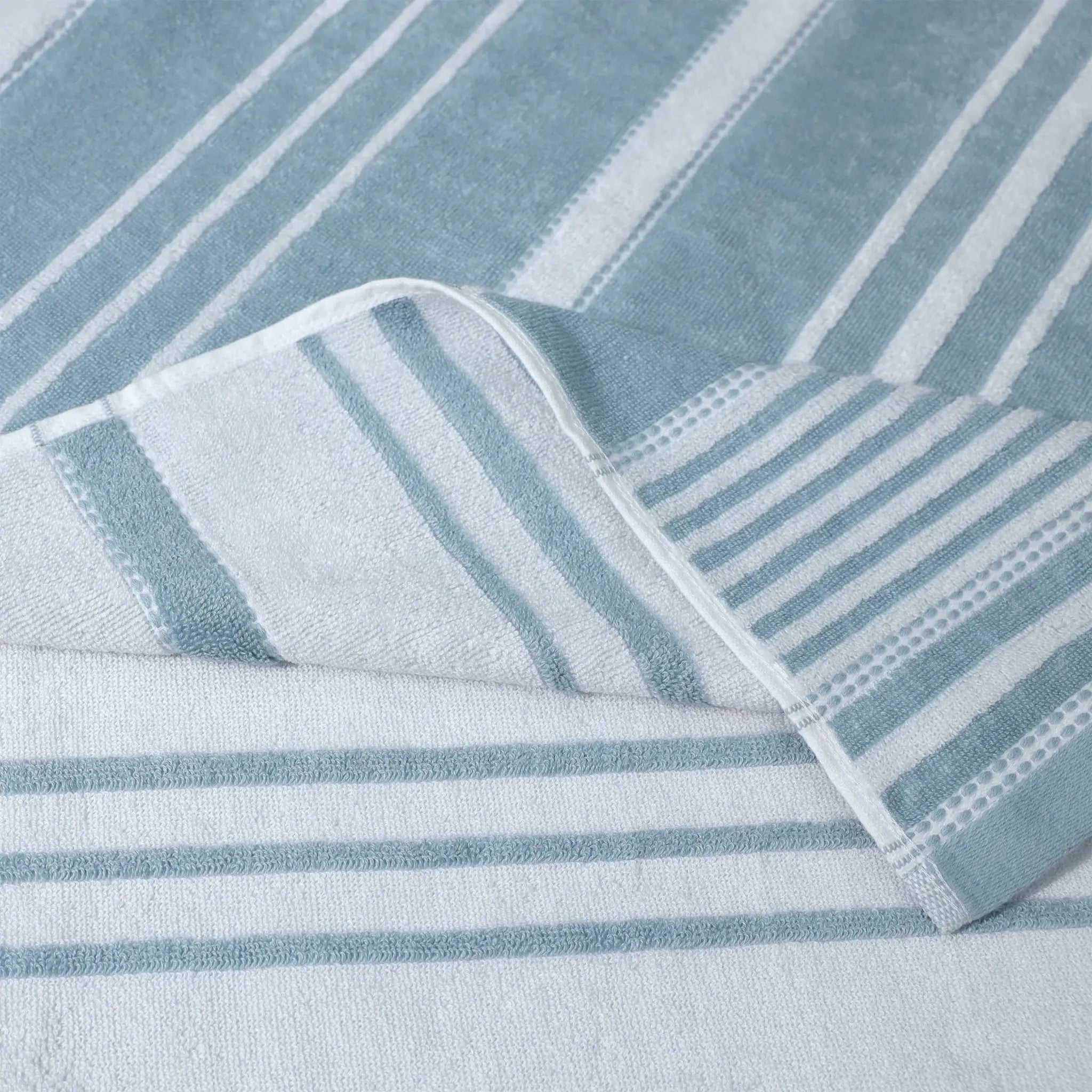 Close-up of mineral striped fabric with a folded corner