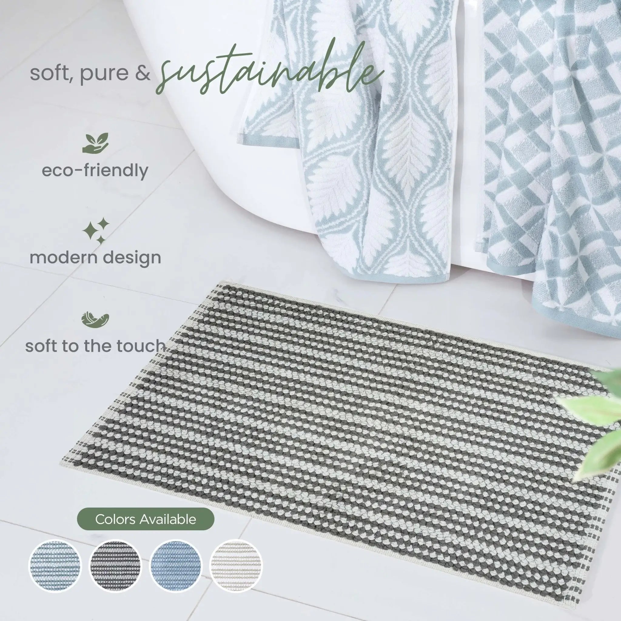 A rectangular charcoal bath rug with a black and white geometric pattern. Text overlays describe the product features, and color swatches are shown at the bottom left.