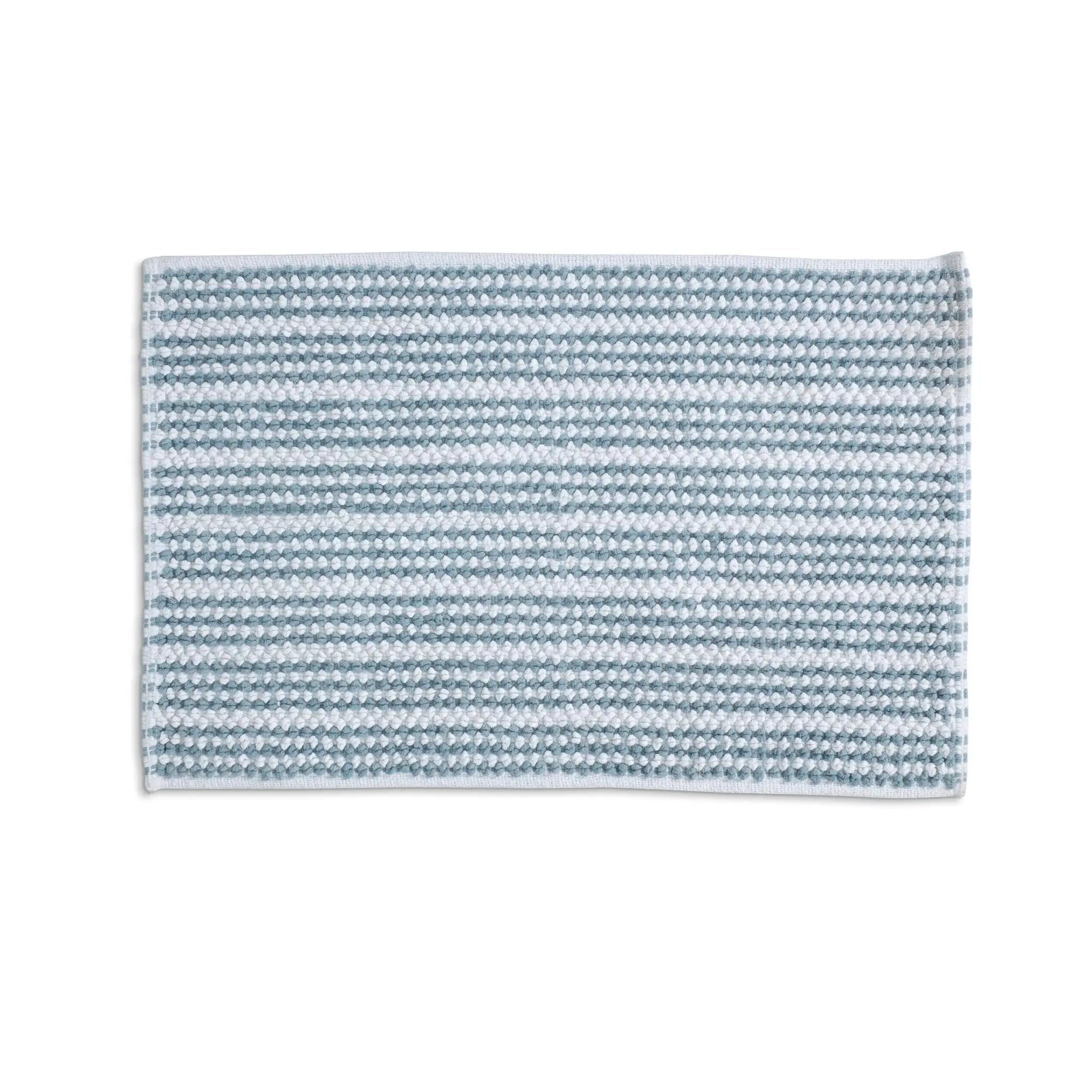 A rectangular mineral bath rug shown flat against a solid white background.
