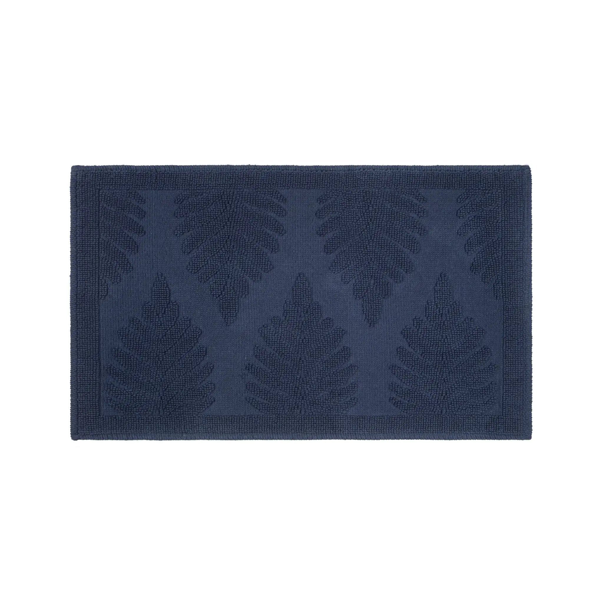 A rectangular navy-blue bath rug featuring a raised embossed leaf pattern, shown flat against a solid white background.