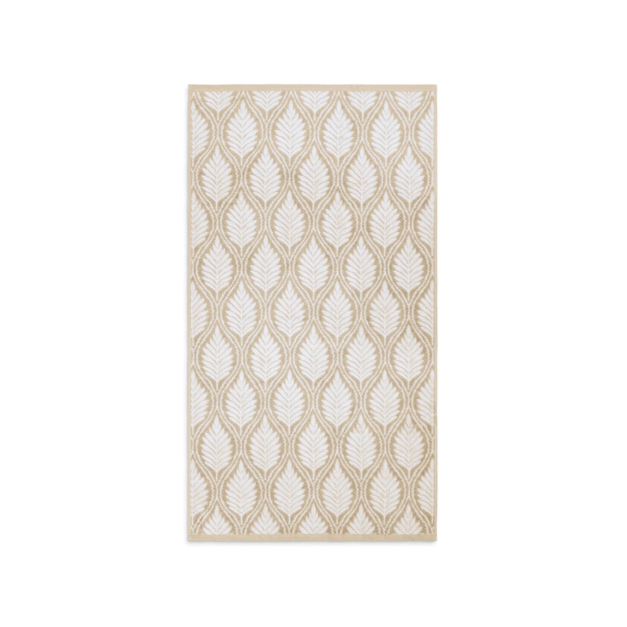 Sand patterned bath towel on a white background