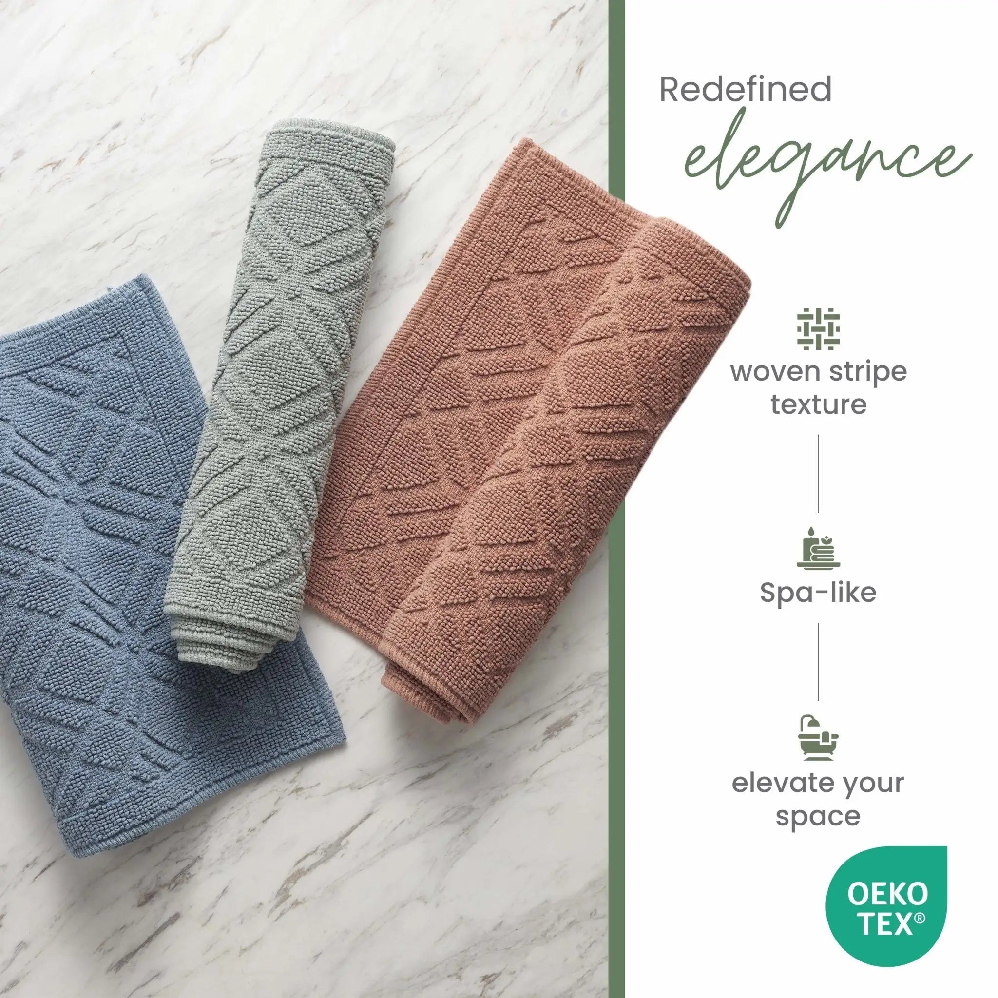 Three textured bath rugs in blue, gray, and clay on a marble surface with 'OEKO-TEX' certification.
