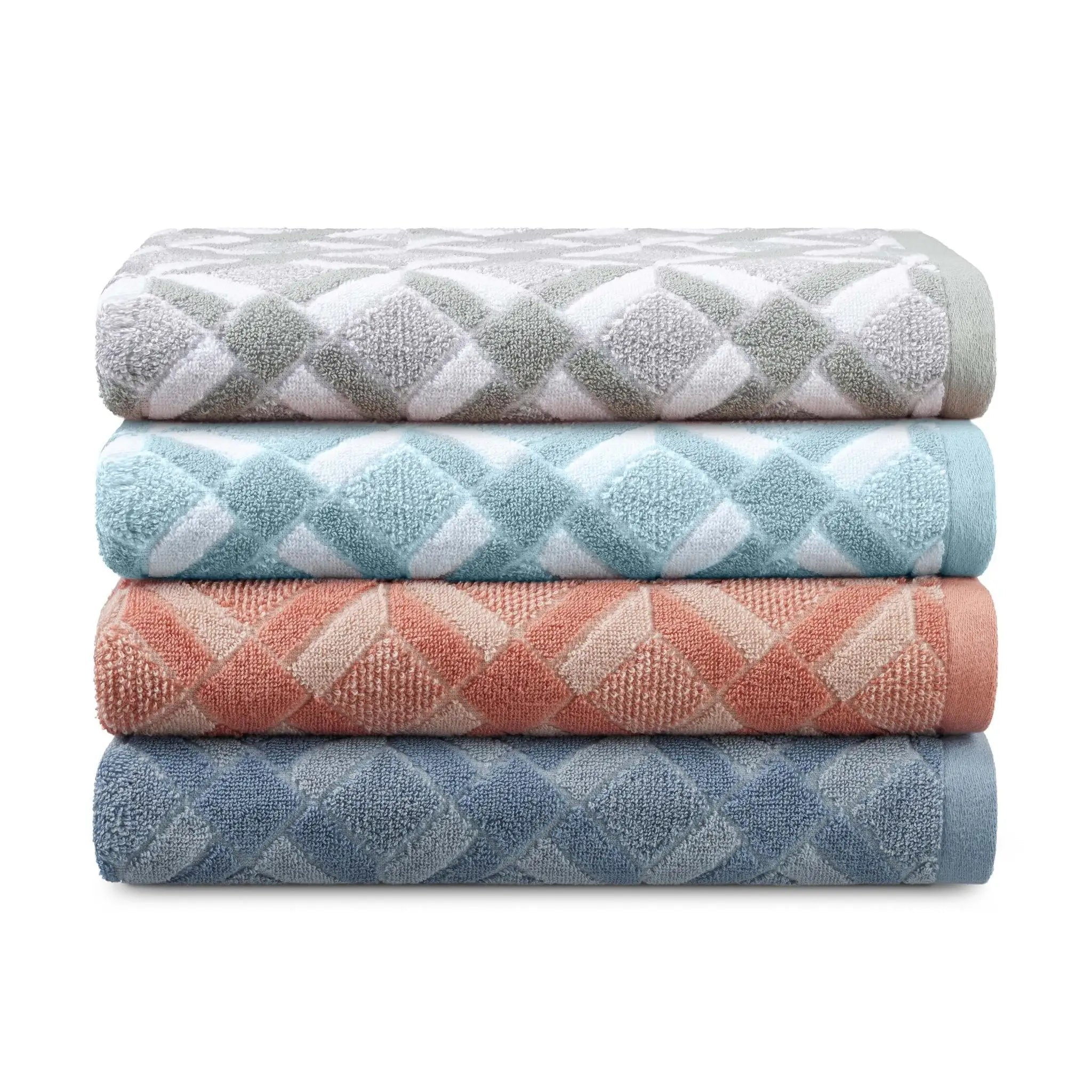 A stack of four folded towels with a repeating diamond pattern in soft neutral and pastel colors, including gray, blue, clay, and mineral, on a white background.