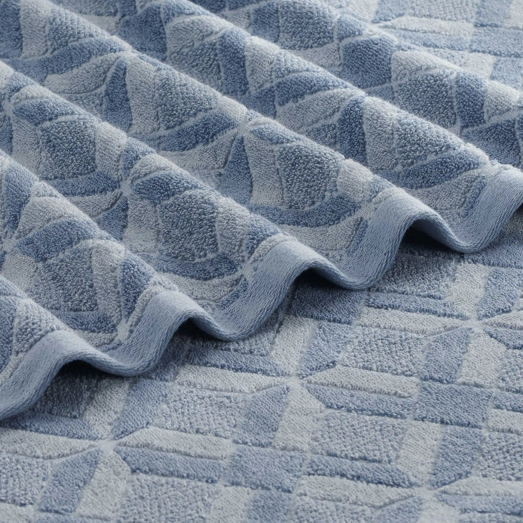 Close-up of a textured blue towel with geometric pattern