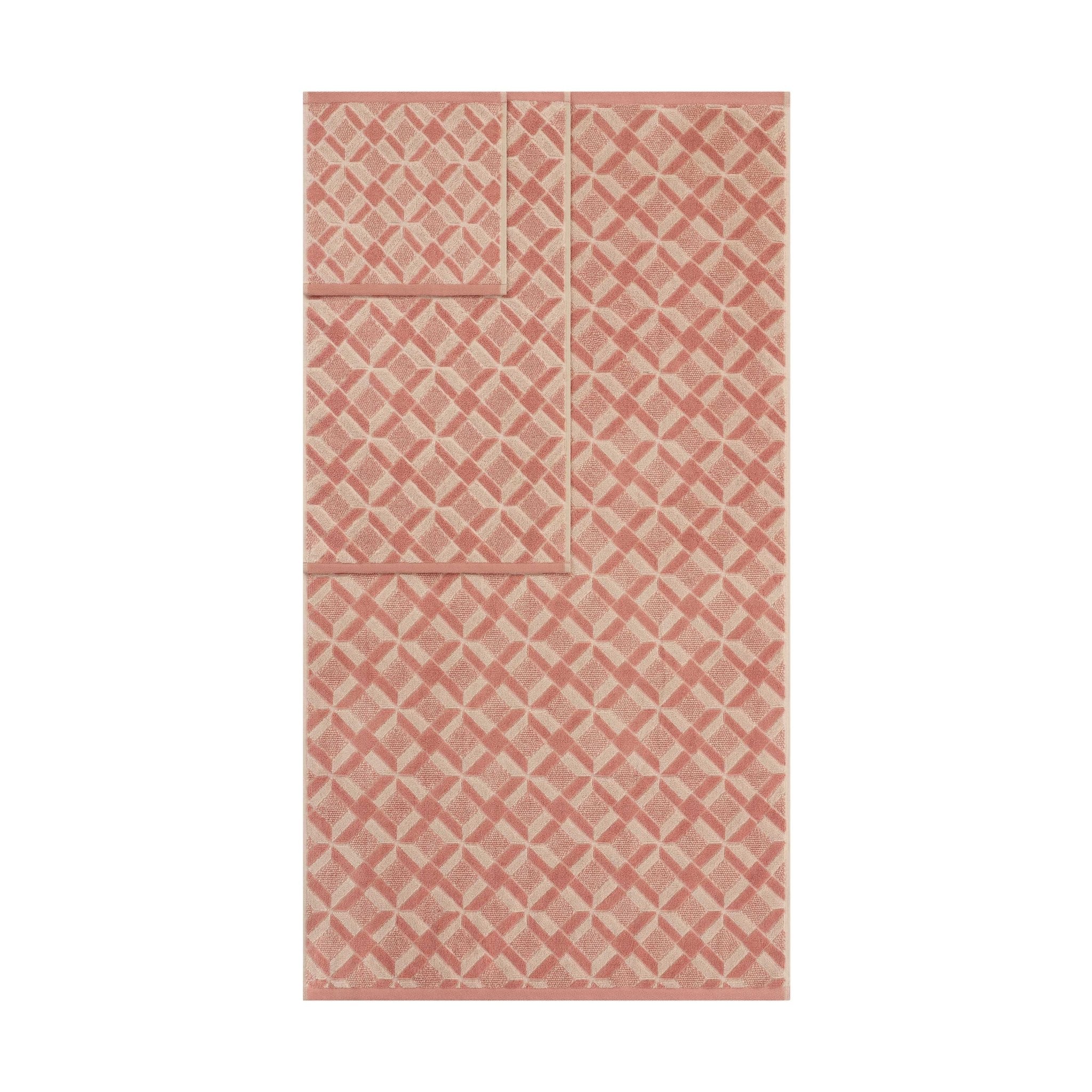 clay-colored patterned towels on a white background