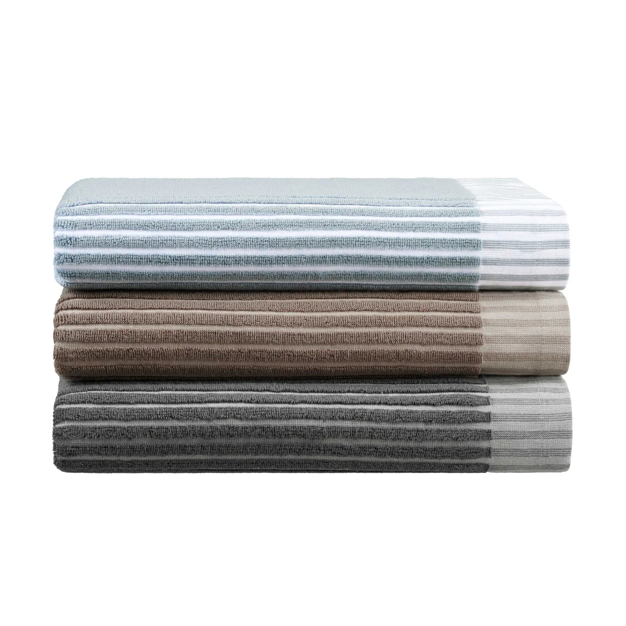 Stack of striped towels in various colors on a white background