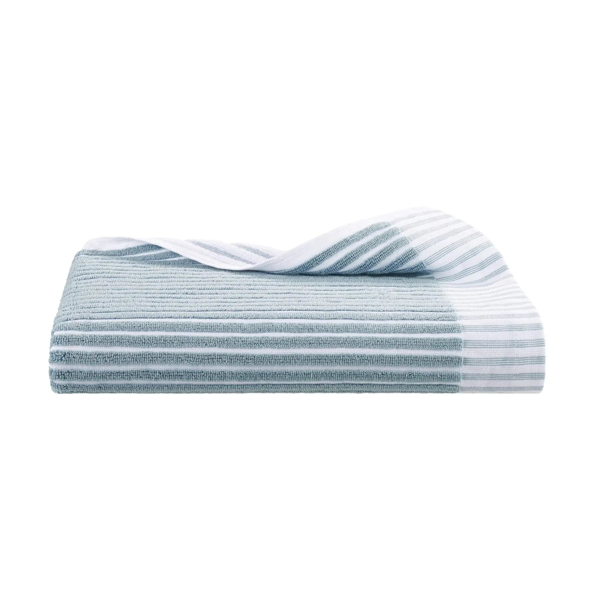 Stack of blue bath towel on a white background