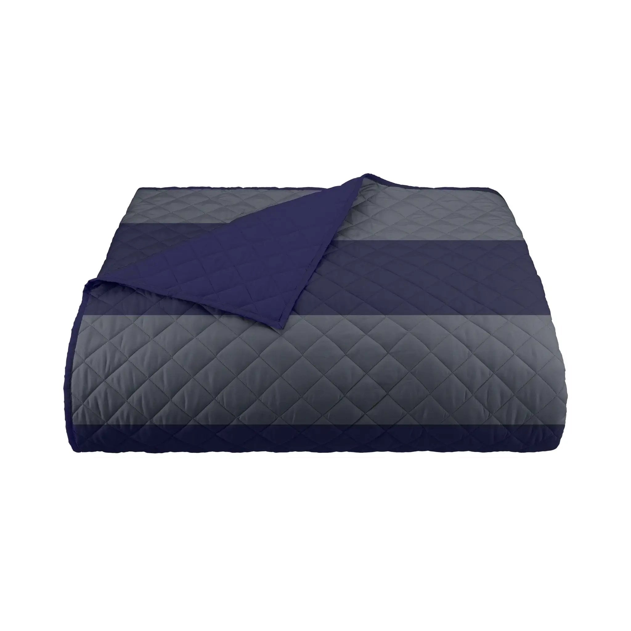 Quilted coverlet with navy and gray pattern on a white background