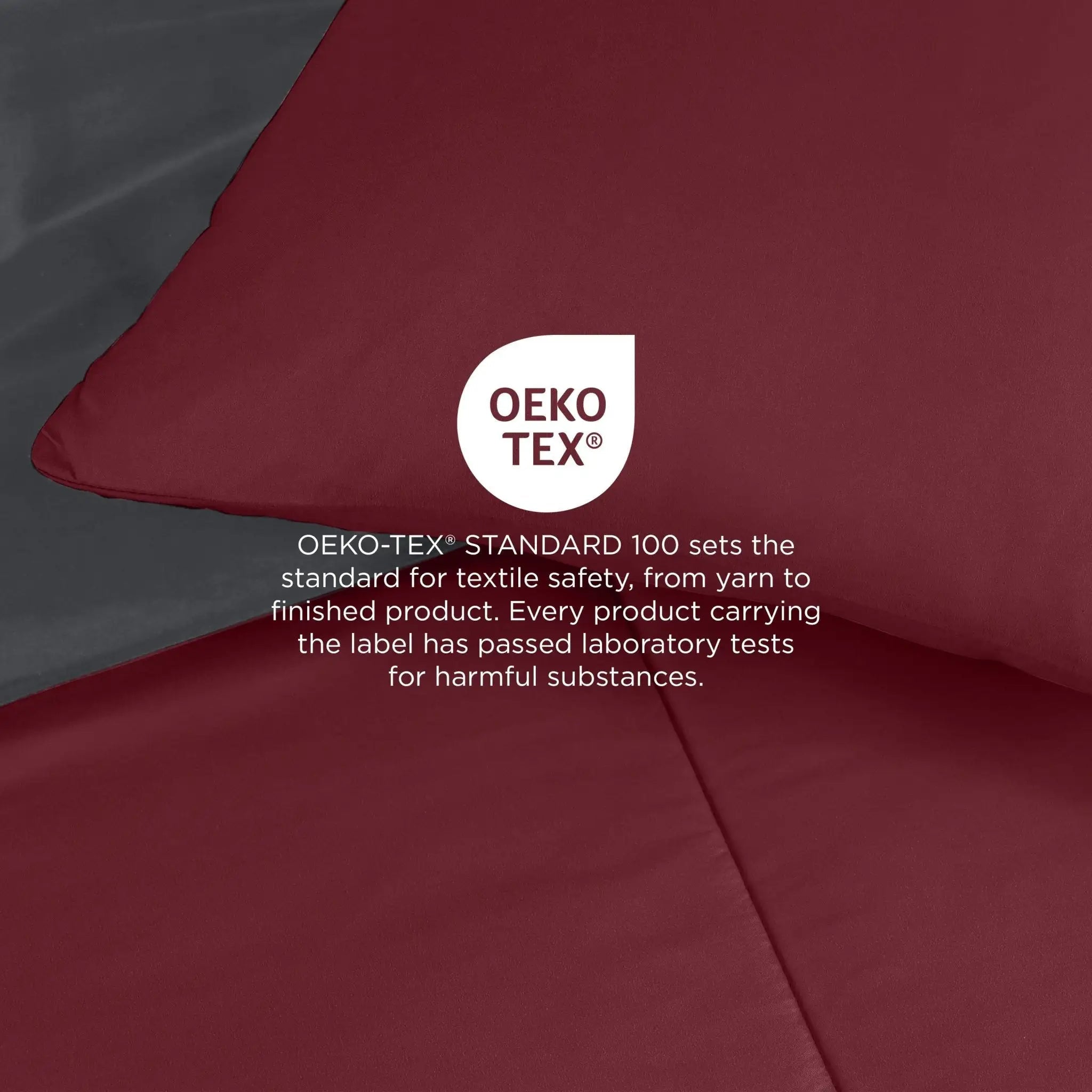 Burgundy comforter, with a white circular OEKO-TEX certification logo and explanatory text overlaid in the center.
