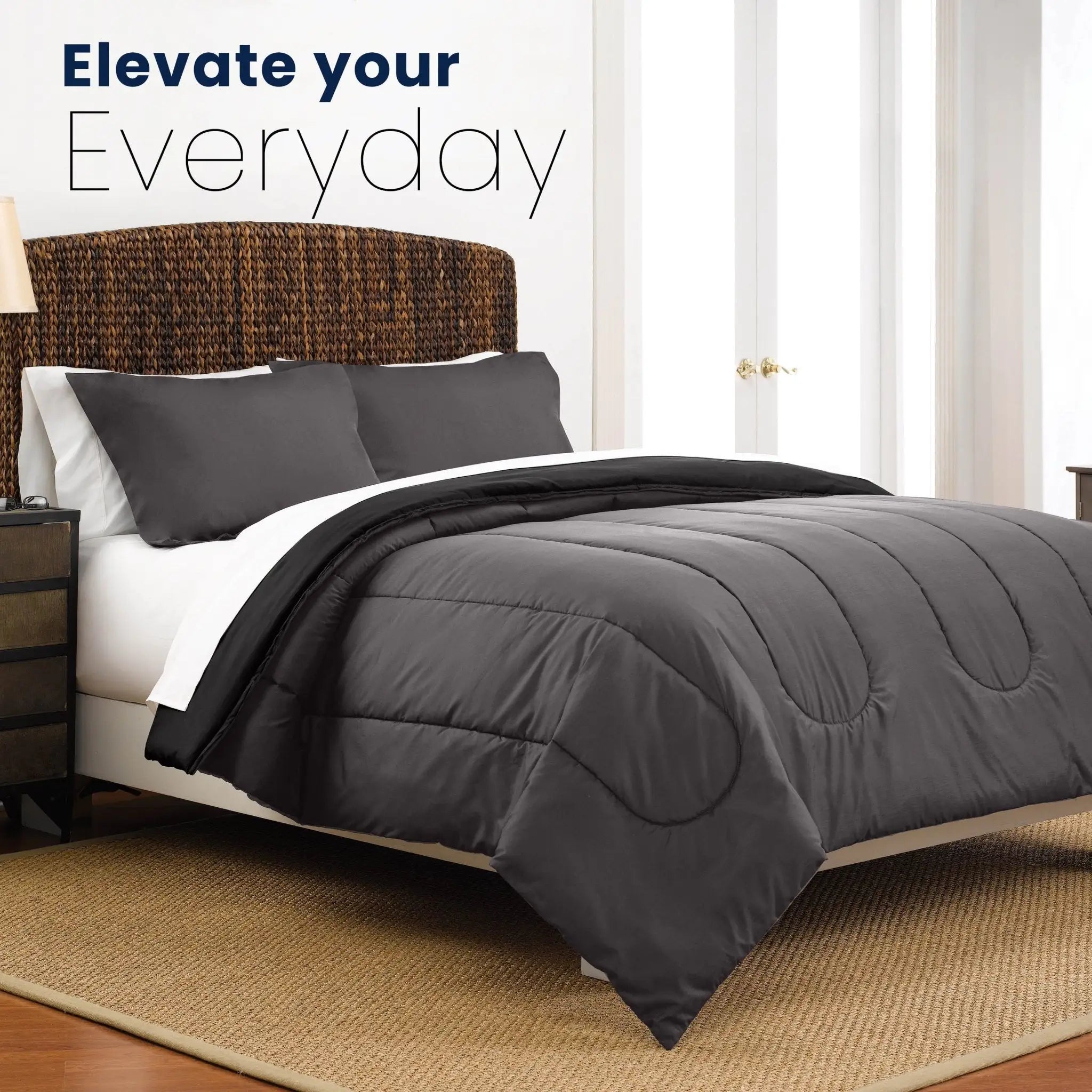 Graphite comforter set on a bed with text 'Elevate your Everyday' in a bedroom setting.