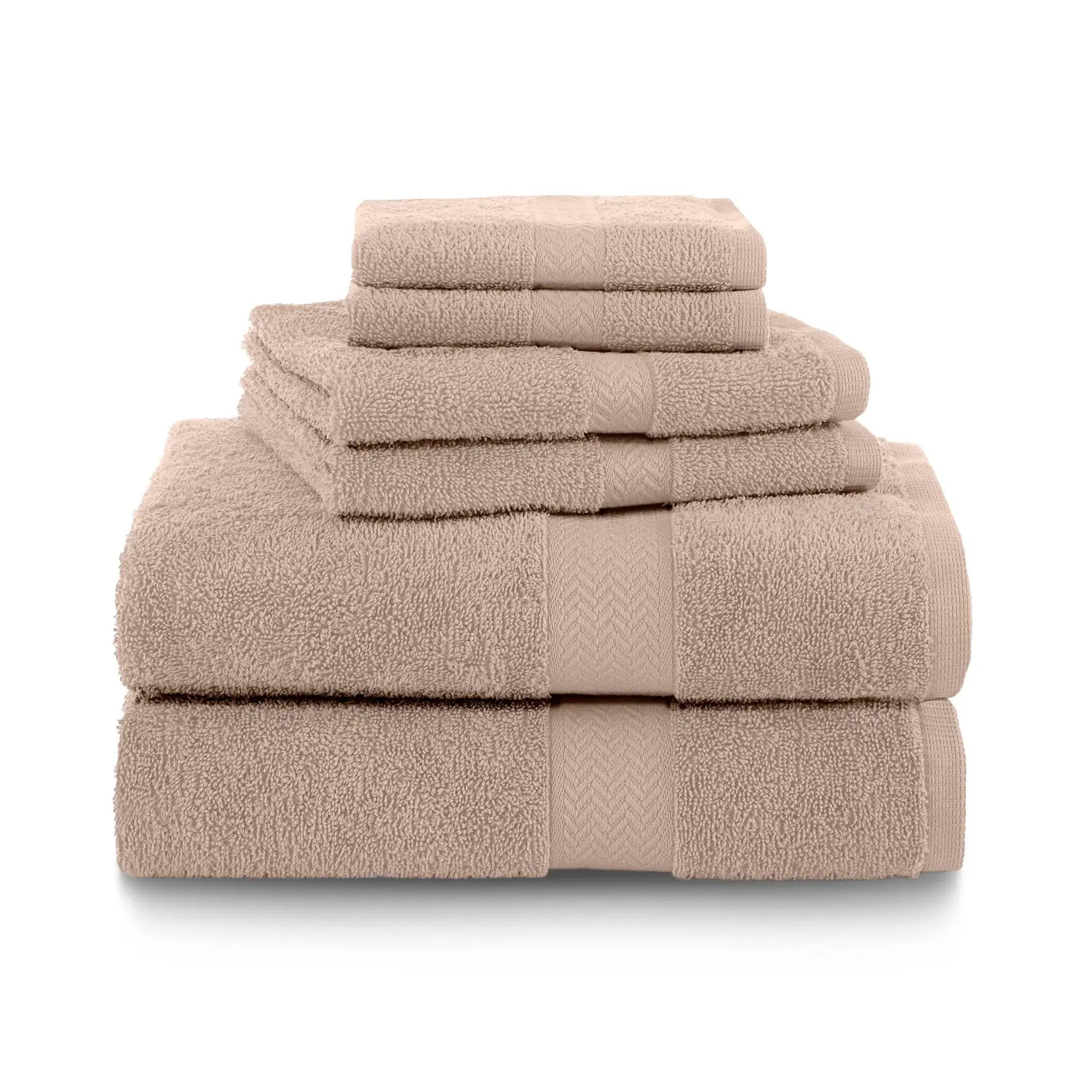 Stack of sand color towel set on a white background