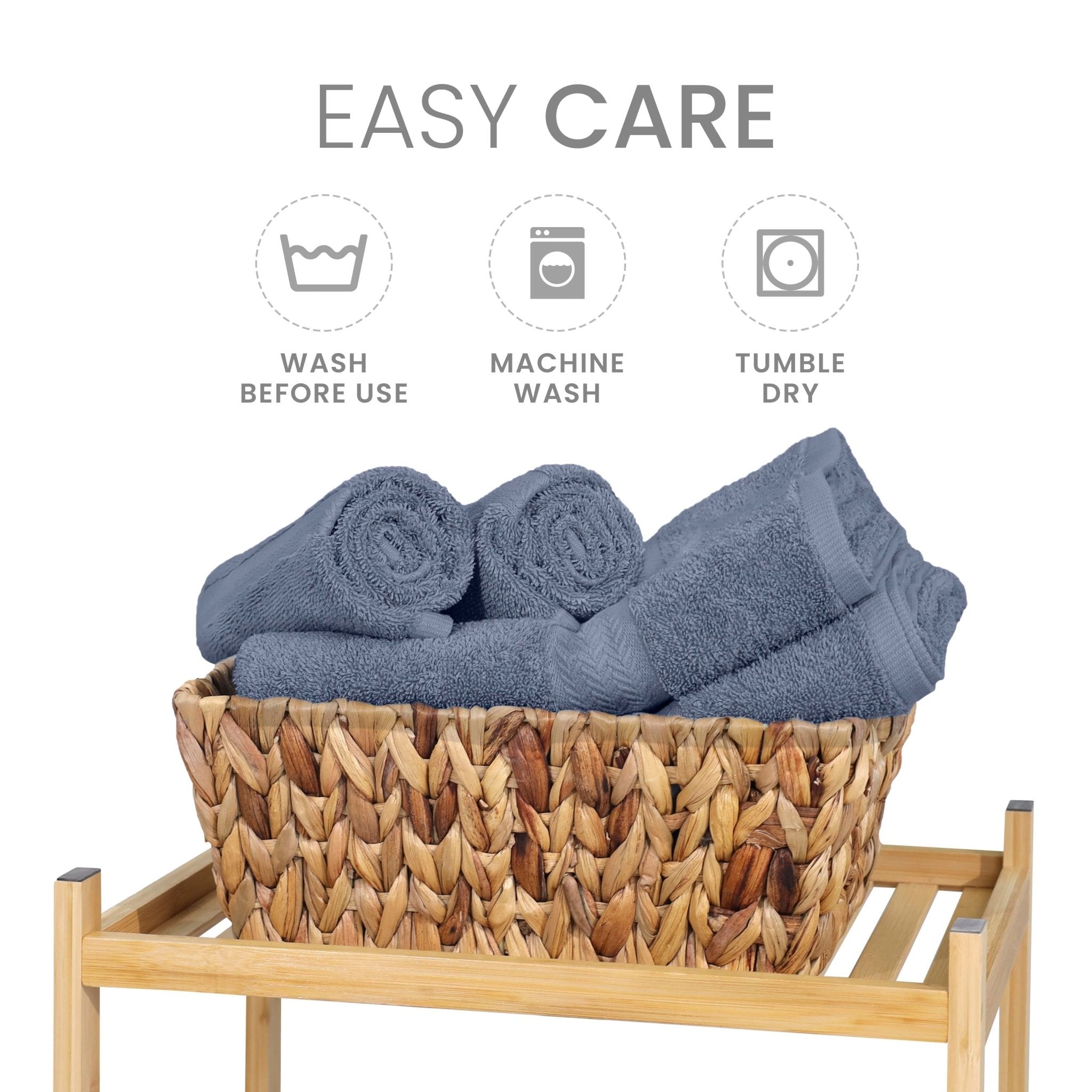 Heather blue towels in a woven basket with washing instructions on a white background