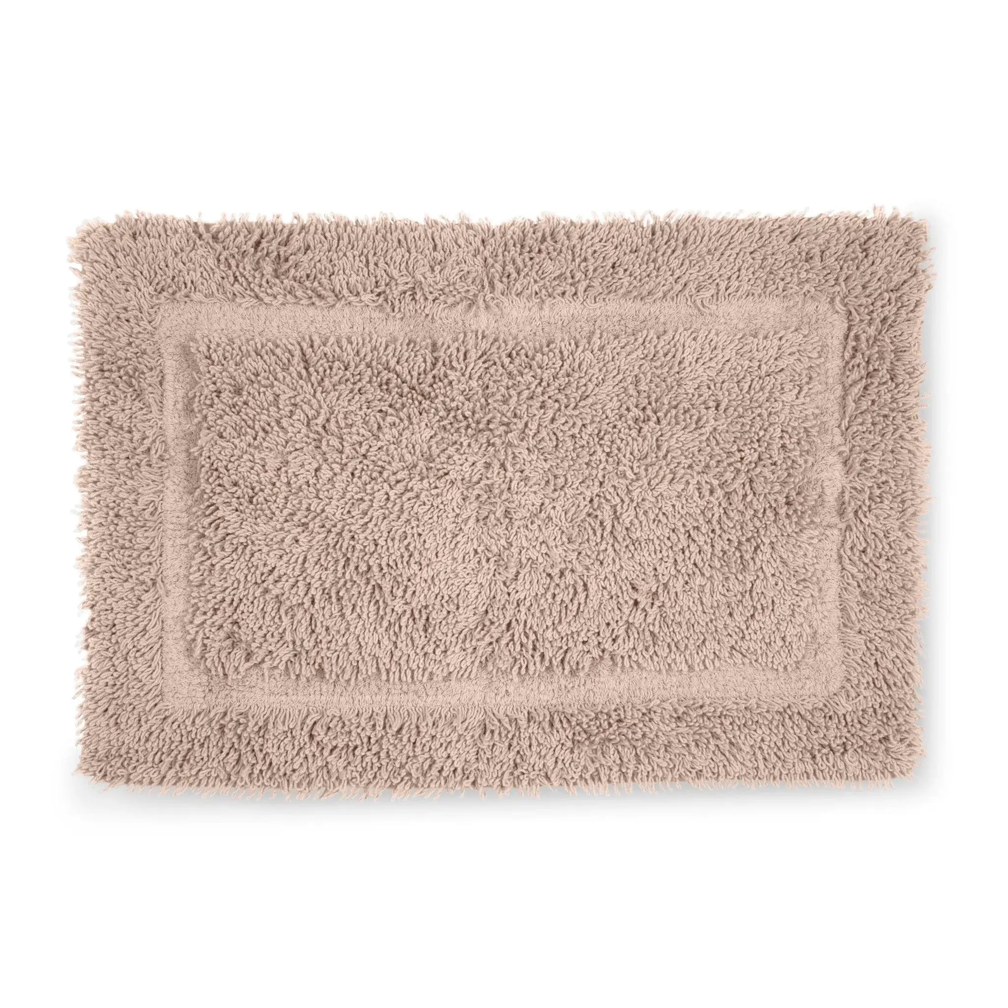 Beige bath rug on a white background
