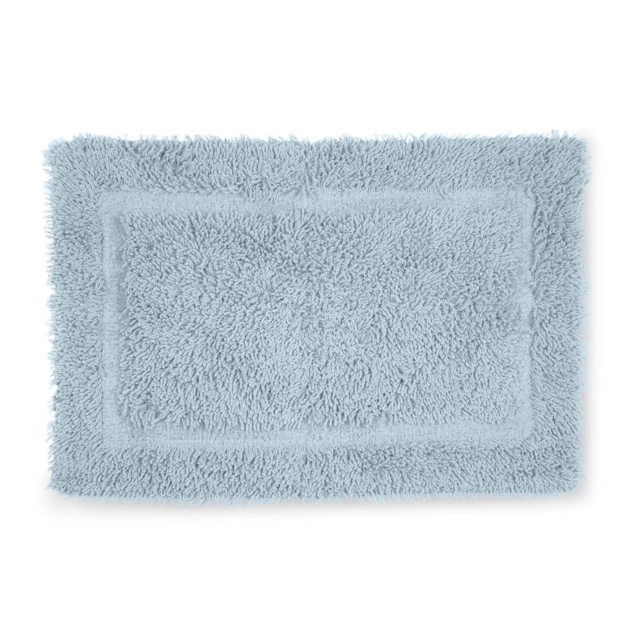 Light blue bath rug on a white background