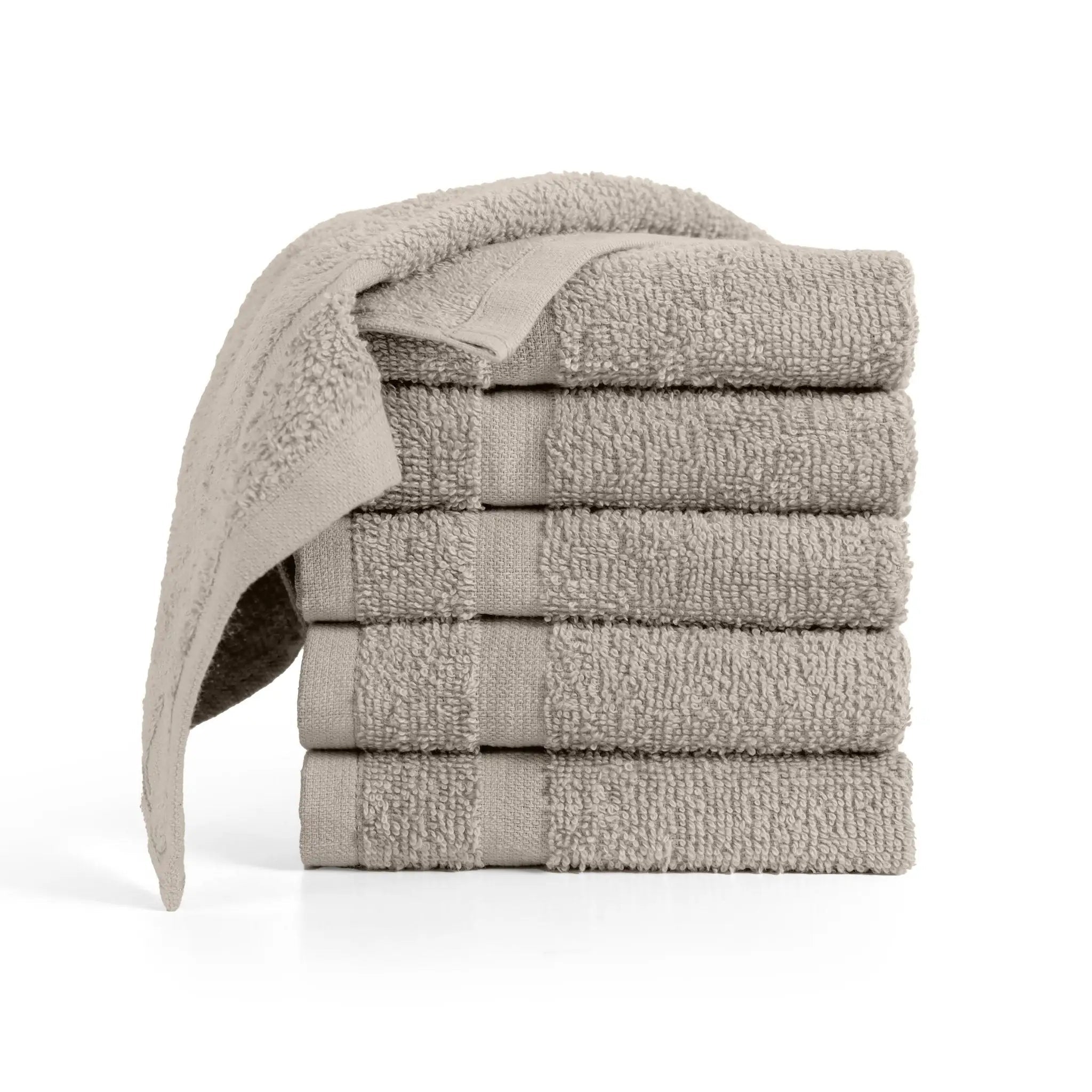 Stack of beige washcloths on a white background