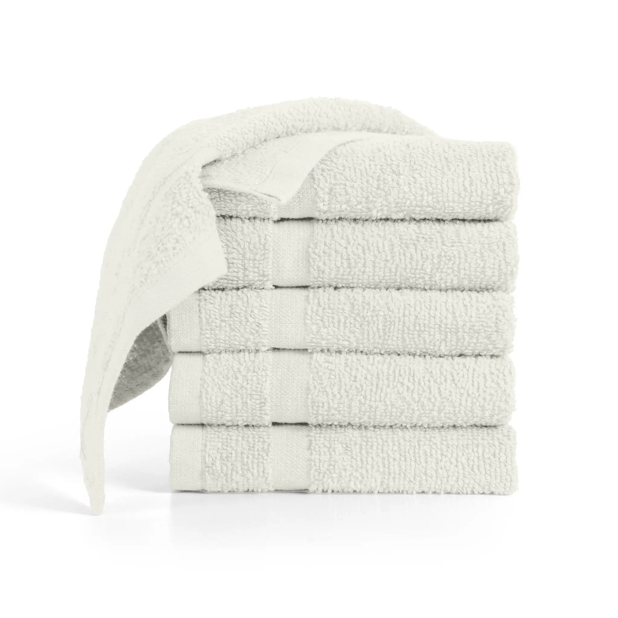 A stack of ivory washcloth with one washcloth draped over the top, on a clean white background.
