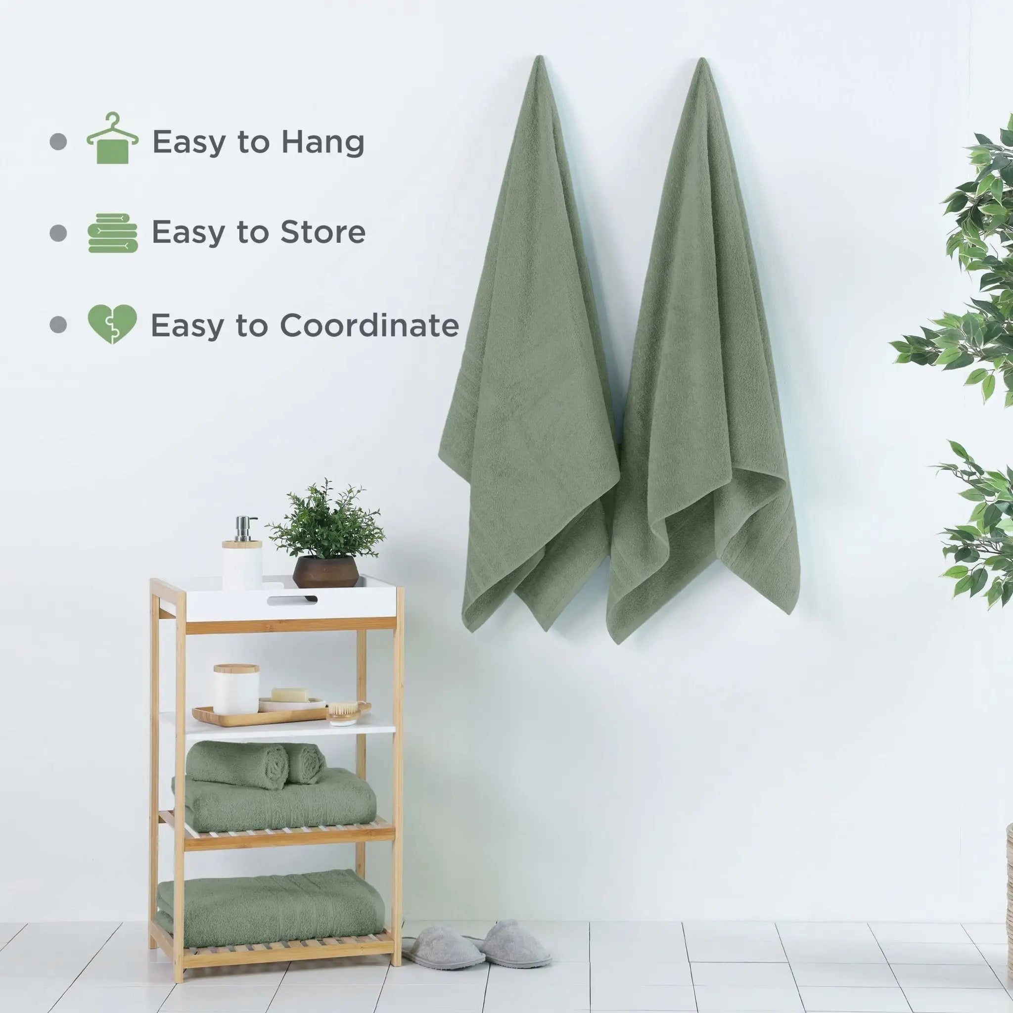 Two sage bath sheets hanging on wall hooks in a bright bathroom setting, with text callouts on the left reading 'Easy to Hang', 'Easy to Store', and 'Easy to Coordinate'.