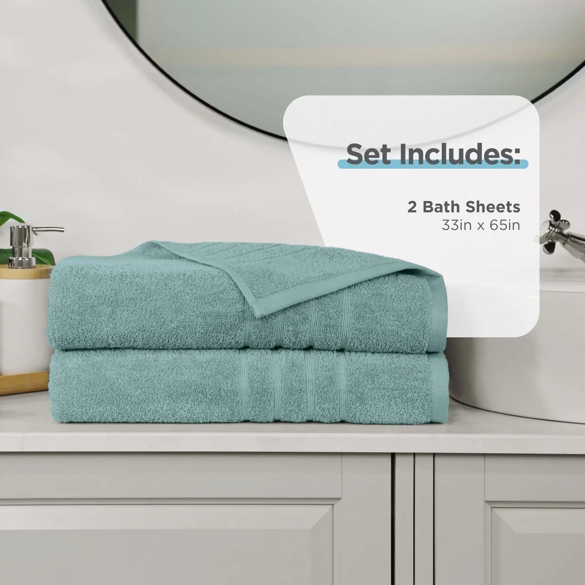 Two folded mineral colored bath sheets stacked on a bathroom counter, with a white informational overlay that reads 'Set Includes: 2 Bath Sheets 33in x 65in'.