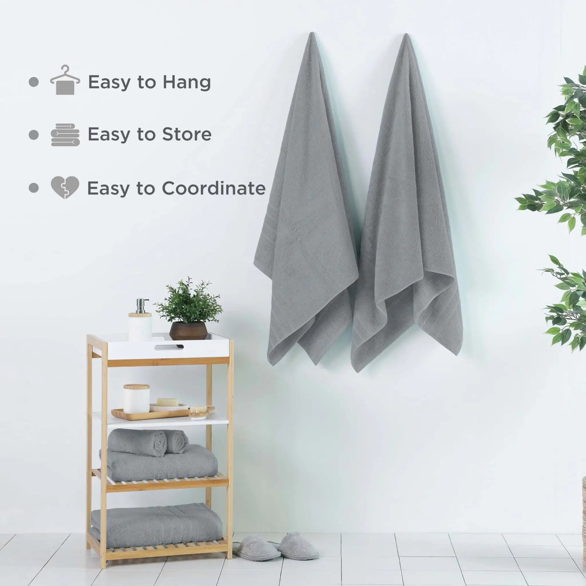 Two gray bath sheets hanging on a wall in a bright bathroom setting. Text on the left reads 'Easy to Hang', 'Easy to Store', and 'Easy to Coordinate'.