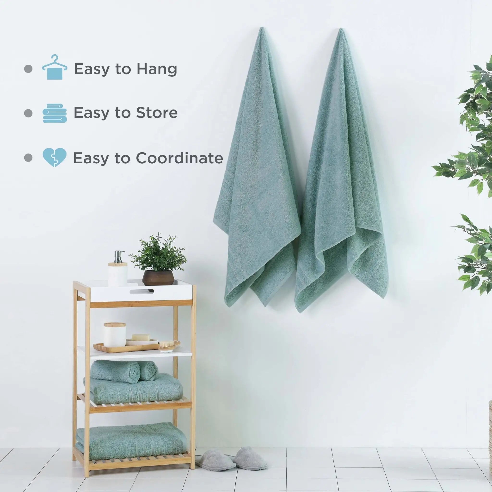Two mineral colored bath sheets hanging on a white wall in a bright bathroom setting, with text overlays listing features: 'Easy to Hang', 'Easy to Store', and 'Easy to Coordinate'.