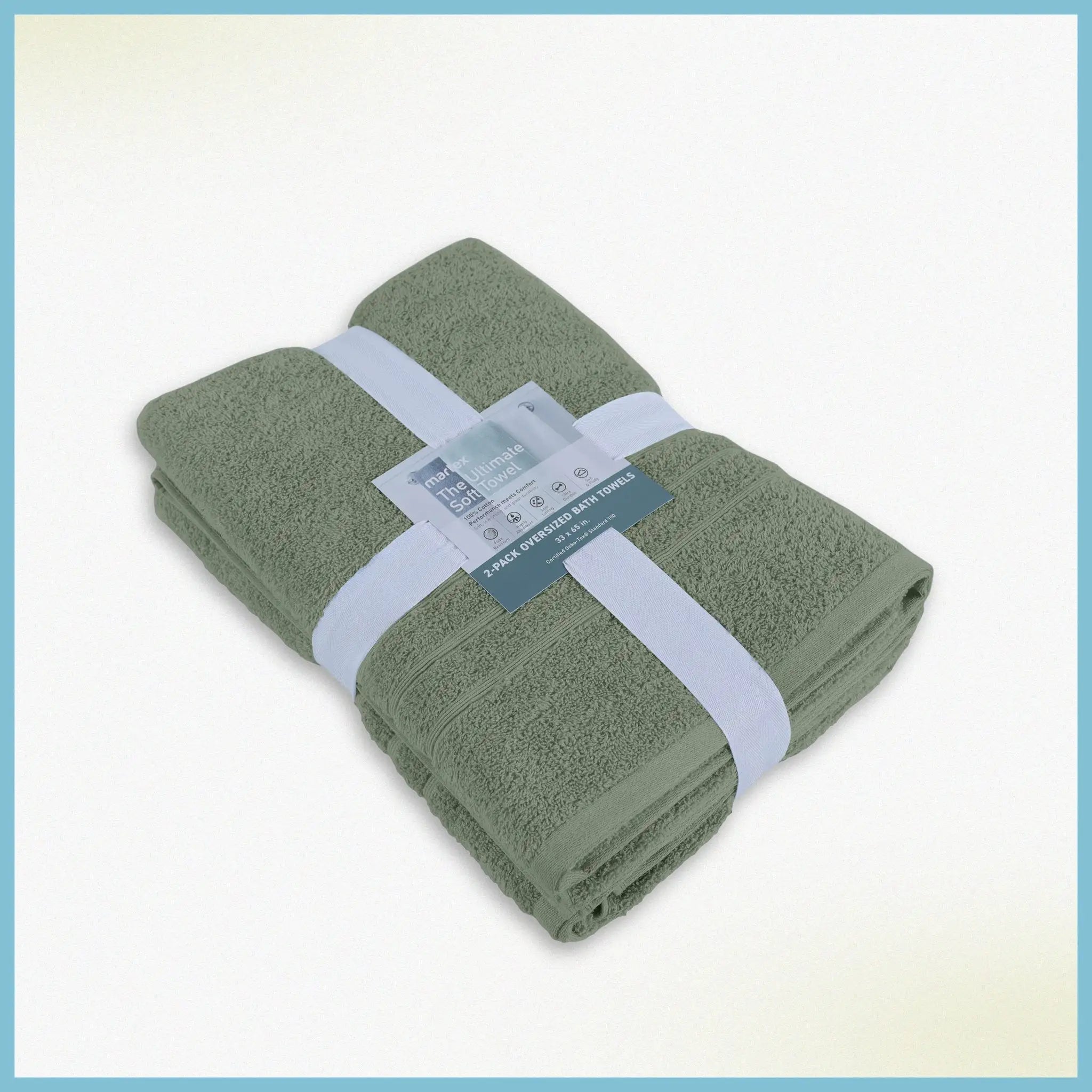 A folded set of sage bath sheets wrapped with a white paper band and a small product tag.