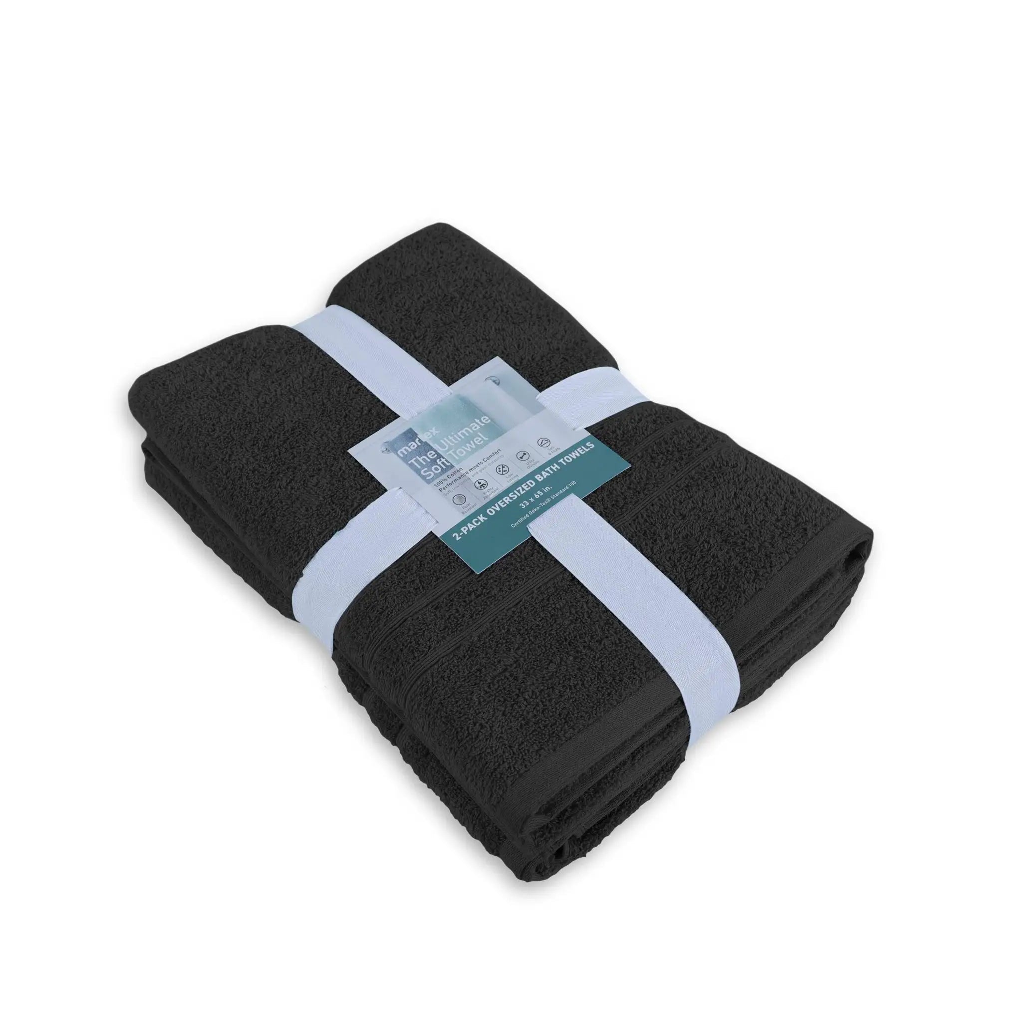 Folded black bath sheet with a label on a white background