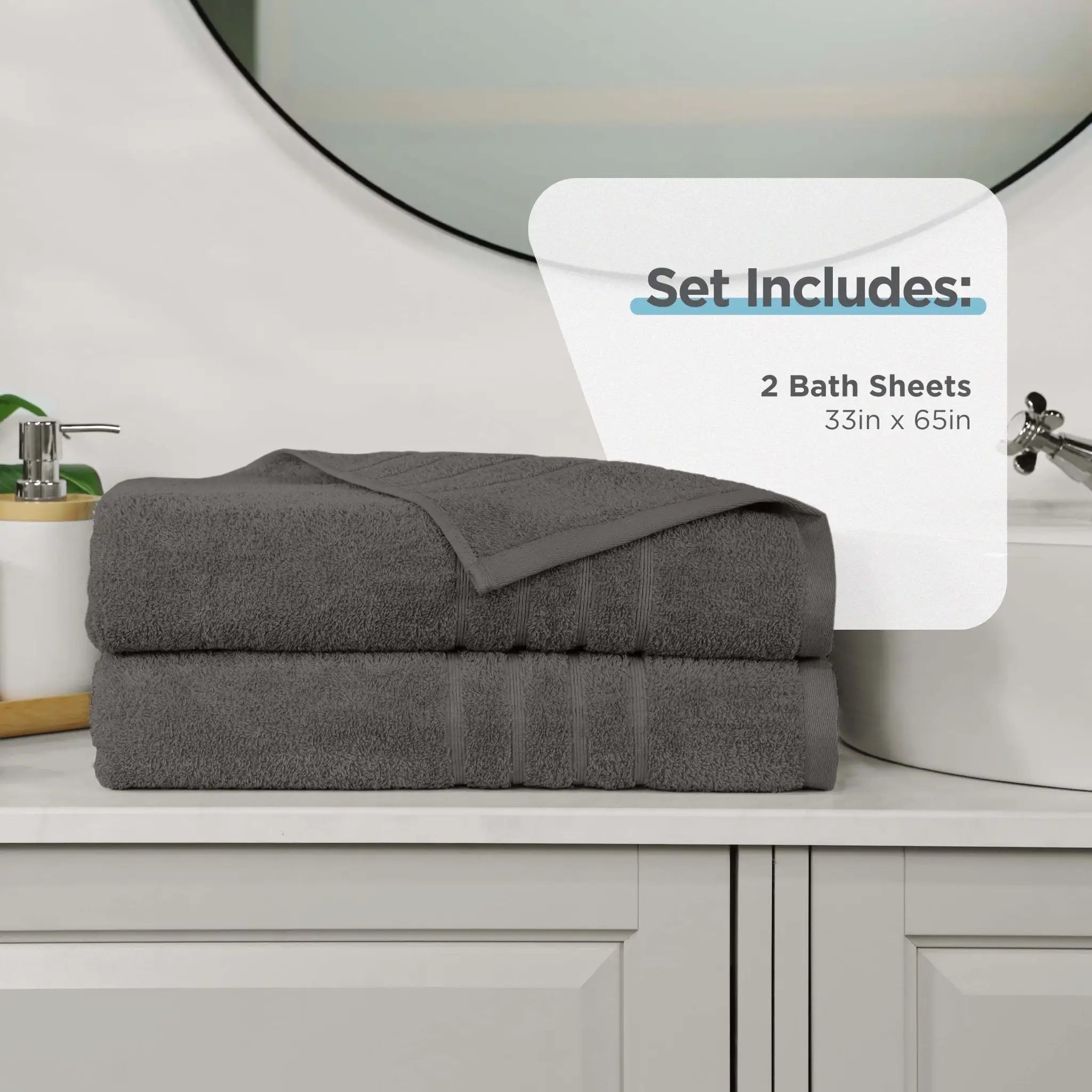 Two dark grey bath sheets on a bathroom counter with product details overlay.