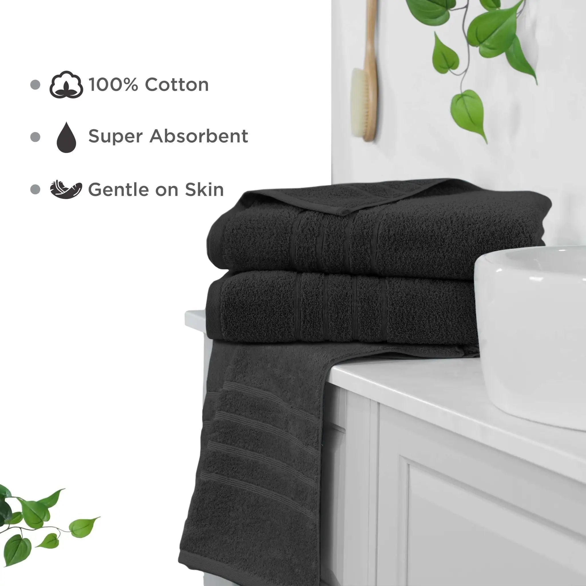Black bath sheets on a white cabinet with text highlighting features like 100% cotton, super absorbent, and gentle on skin.