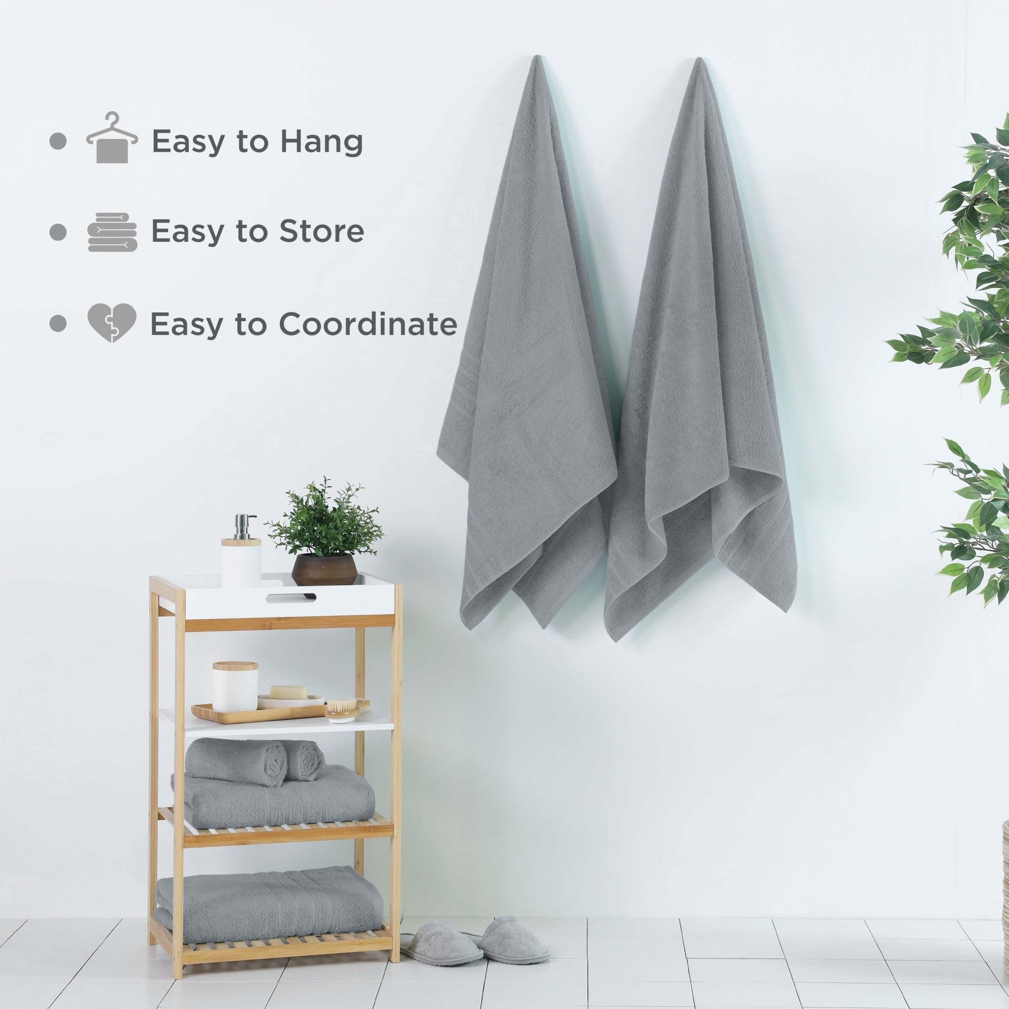 Spa blue bath sheets hanging on a wall, featuring text about towel features.
