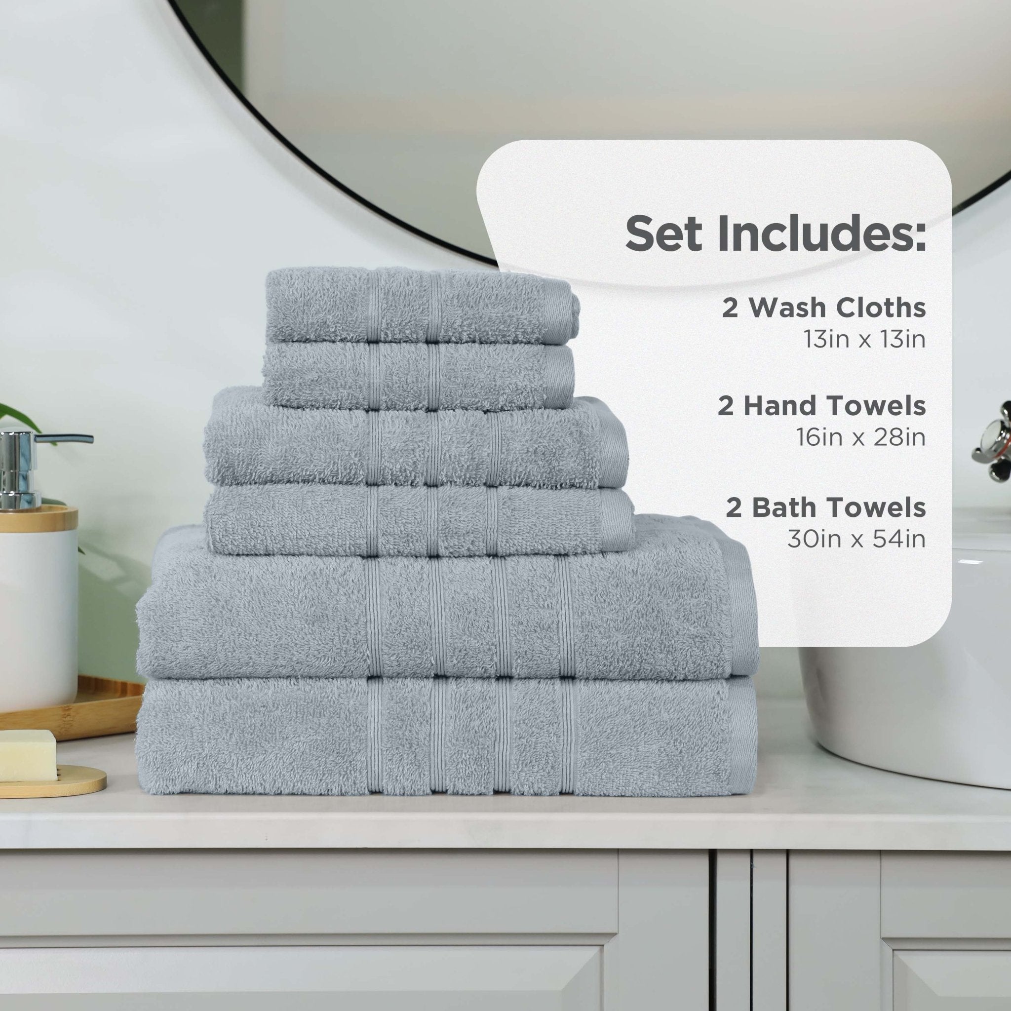 Spa blue towel set with dimensions displayed on a bathroom counter.