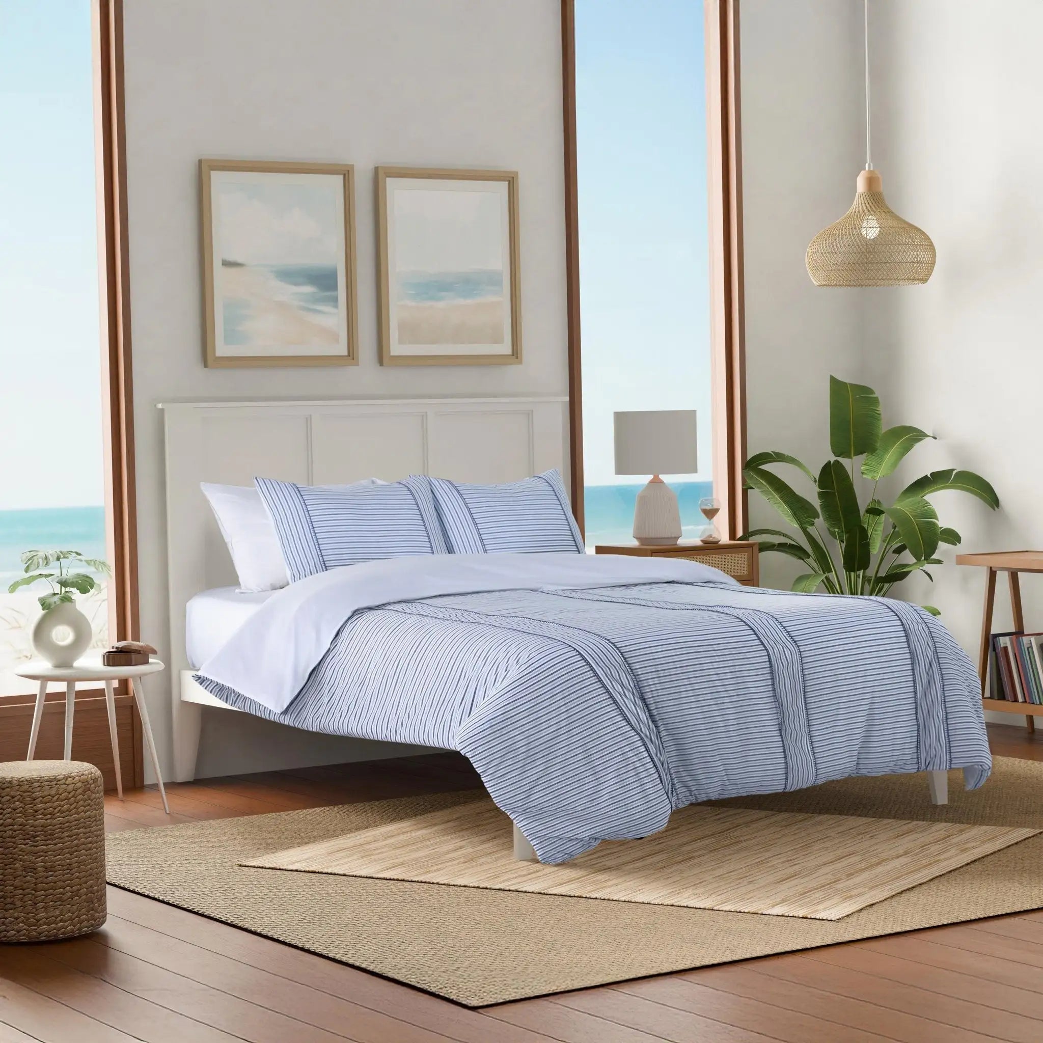 Bedroom with blue striped bedding.
