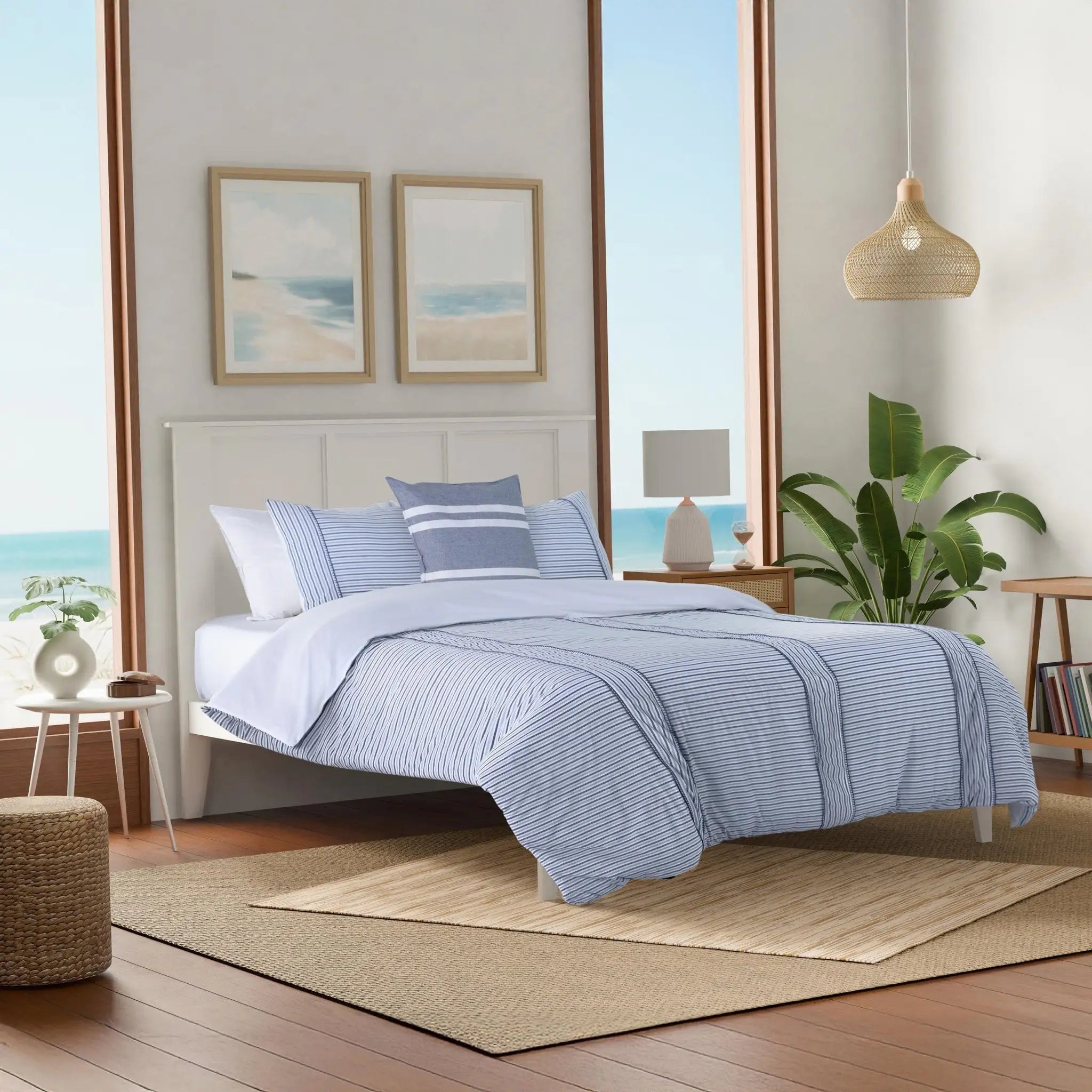 Bedroom with blue striped comforter set.