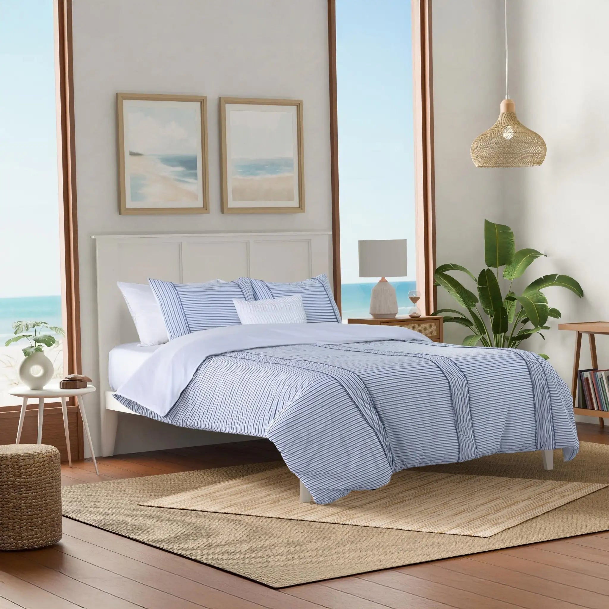 Bedroom with blue striped comforter set.