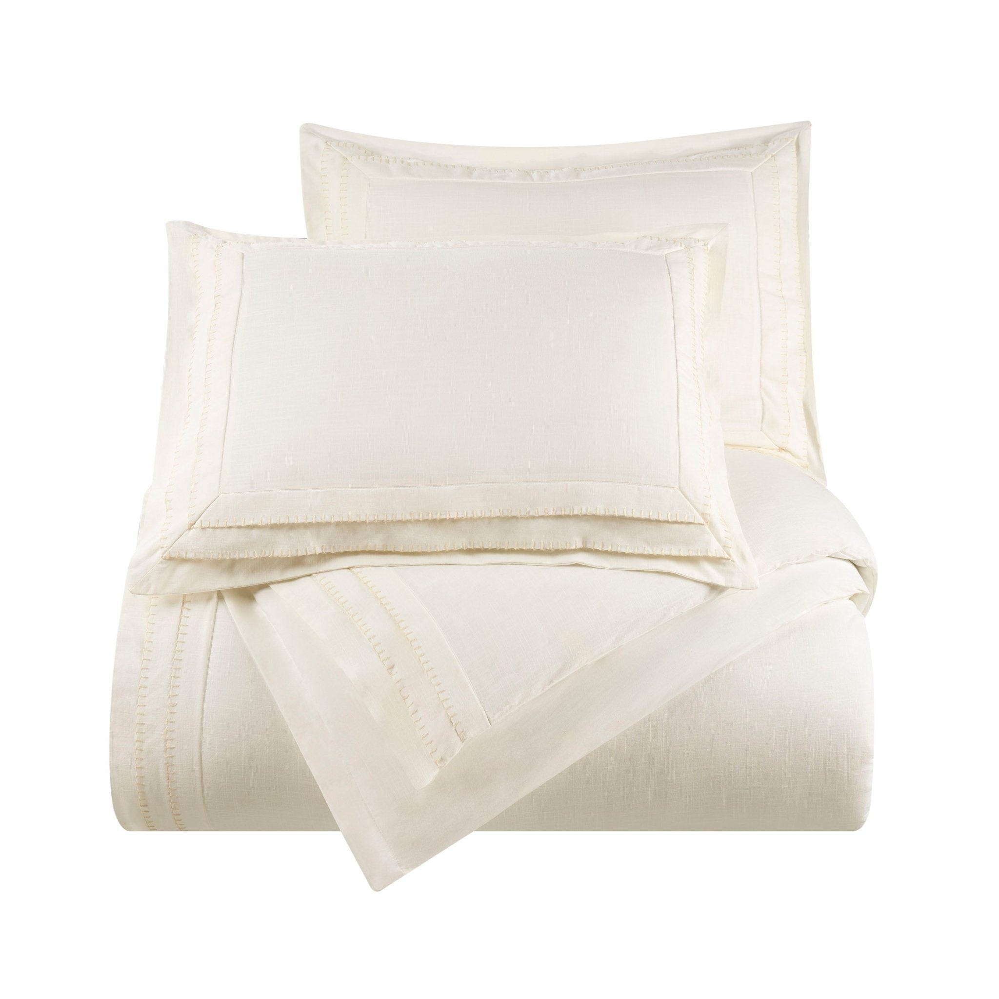 Folded beige comforter set on a white background