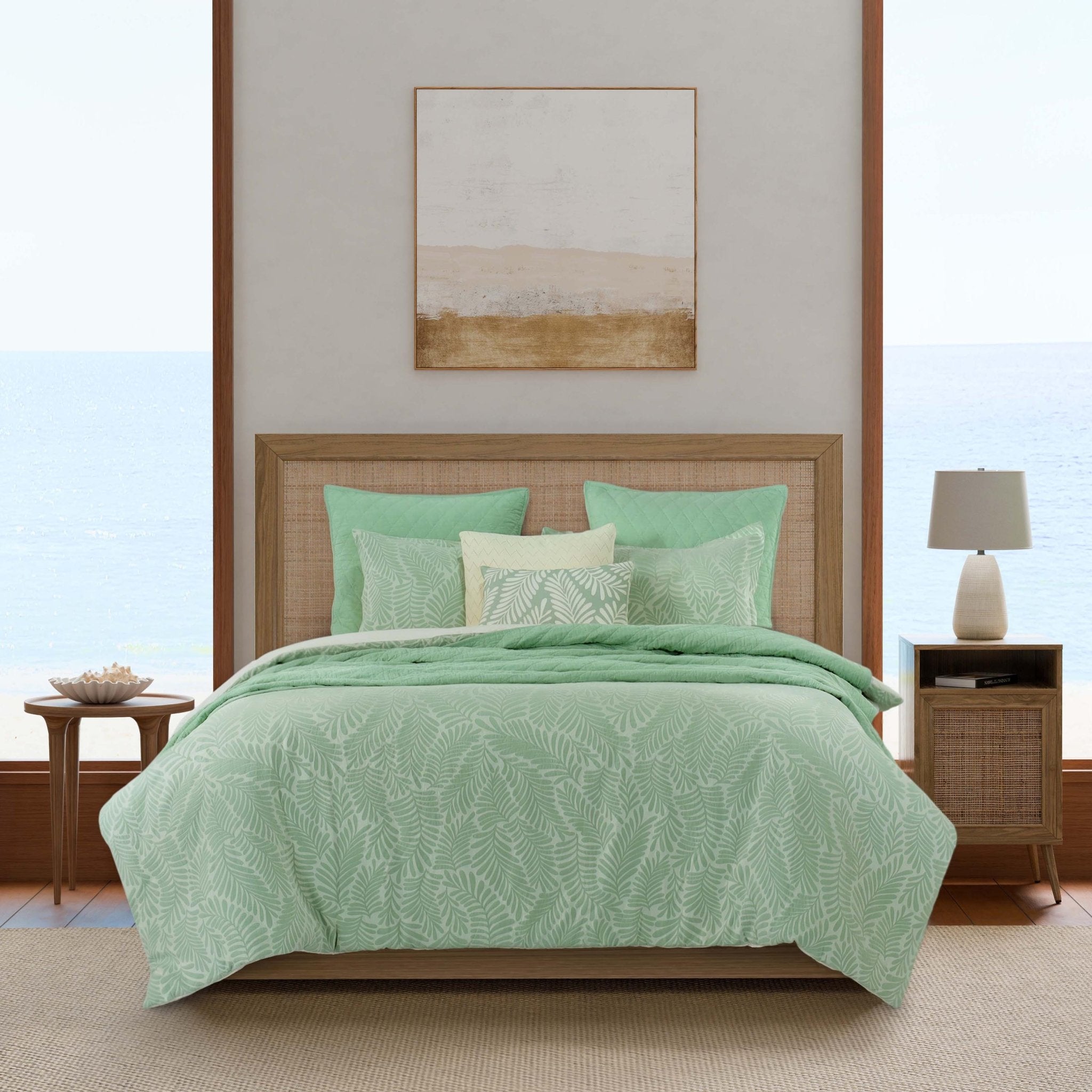 Bedroom with green leaf-patterned comforter set