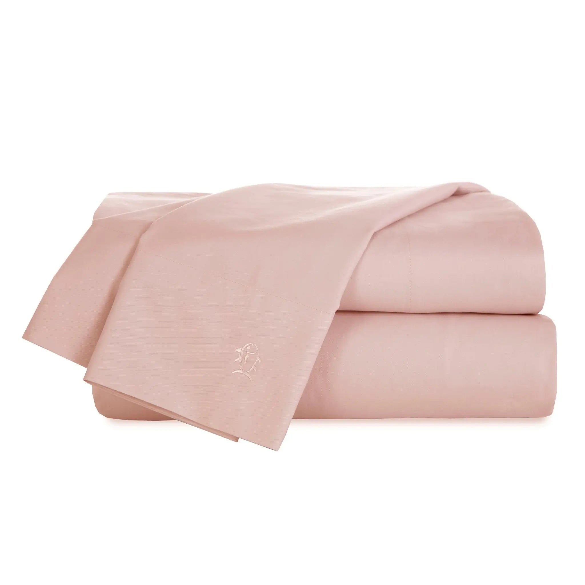 A folded pink bedding set, including a flat sheet and a pillowcase, displayed on a clean white background.