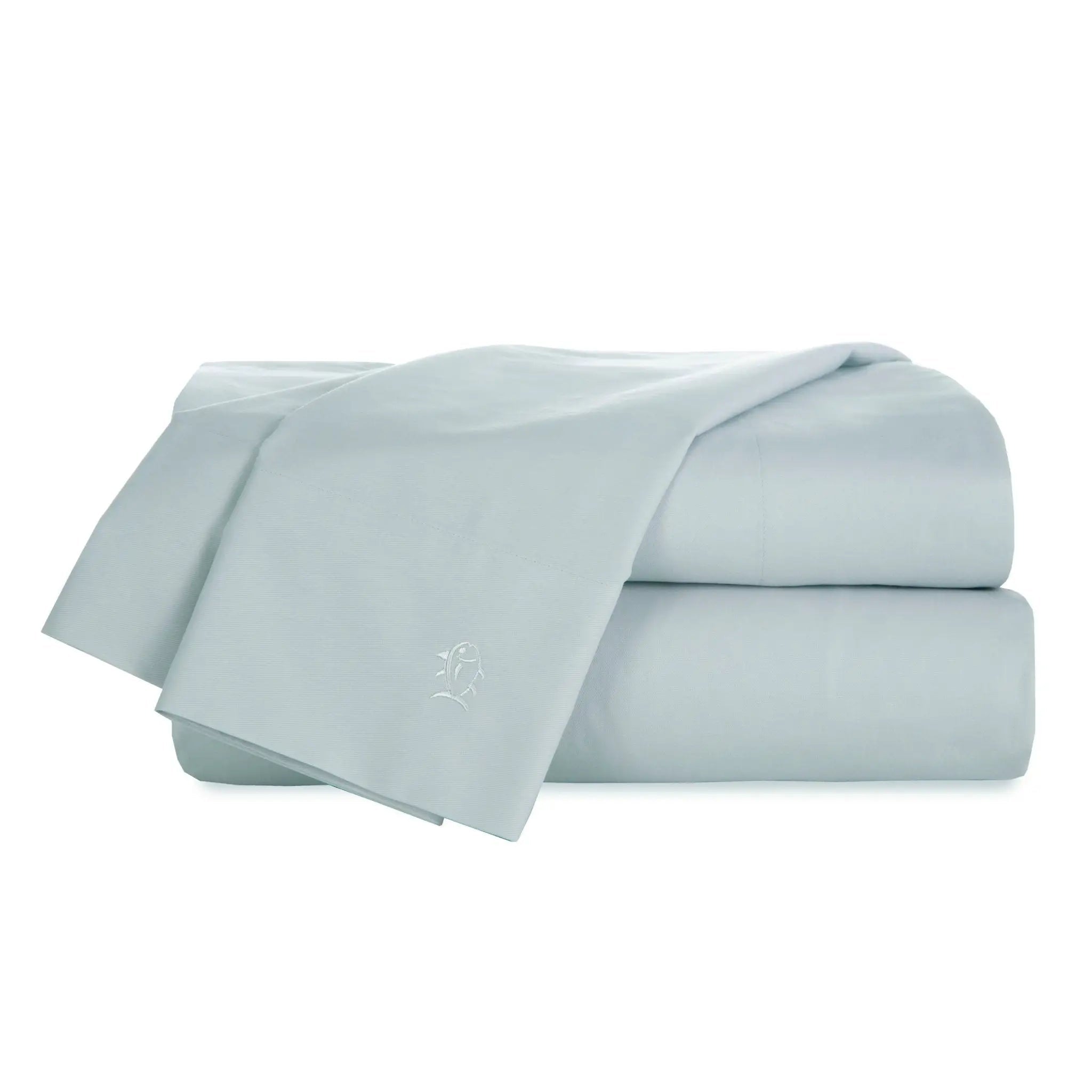 Light blue bed sheets stacked on a white background
