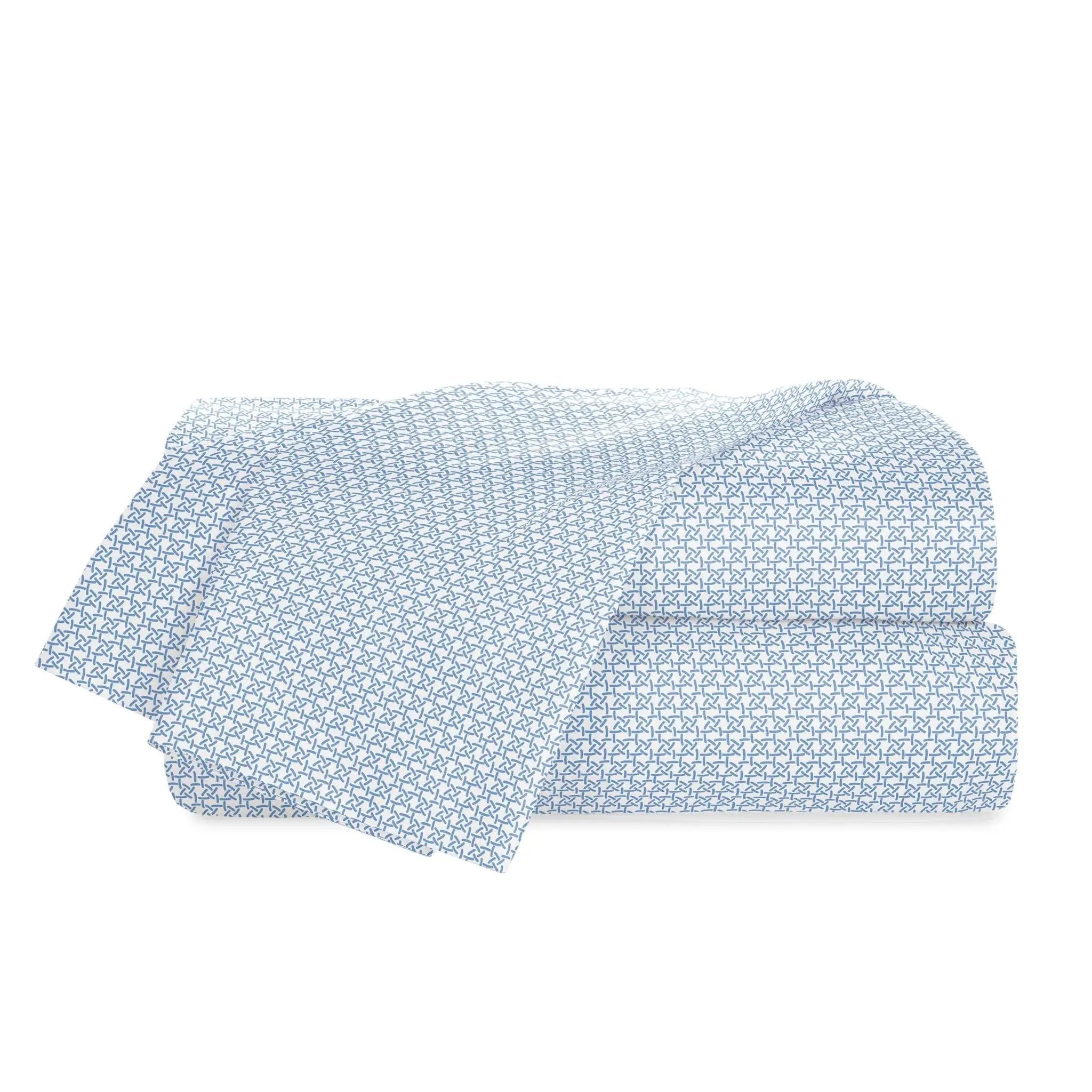 A folded light blue and white patterned sheets, displayed on a clean white background.