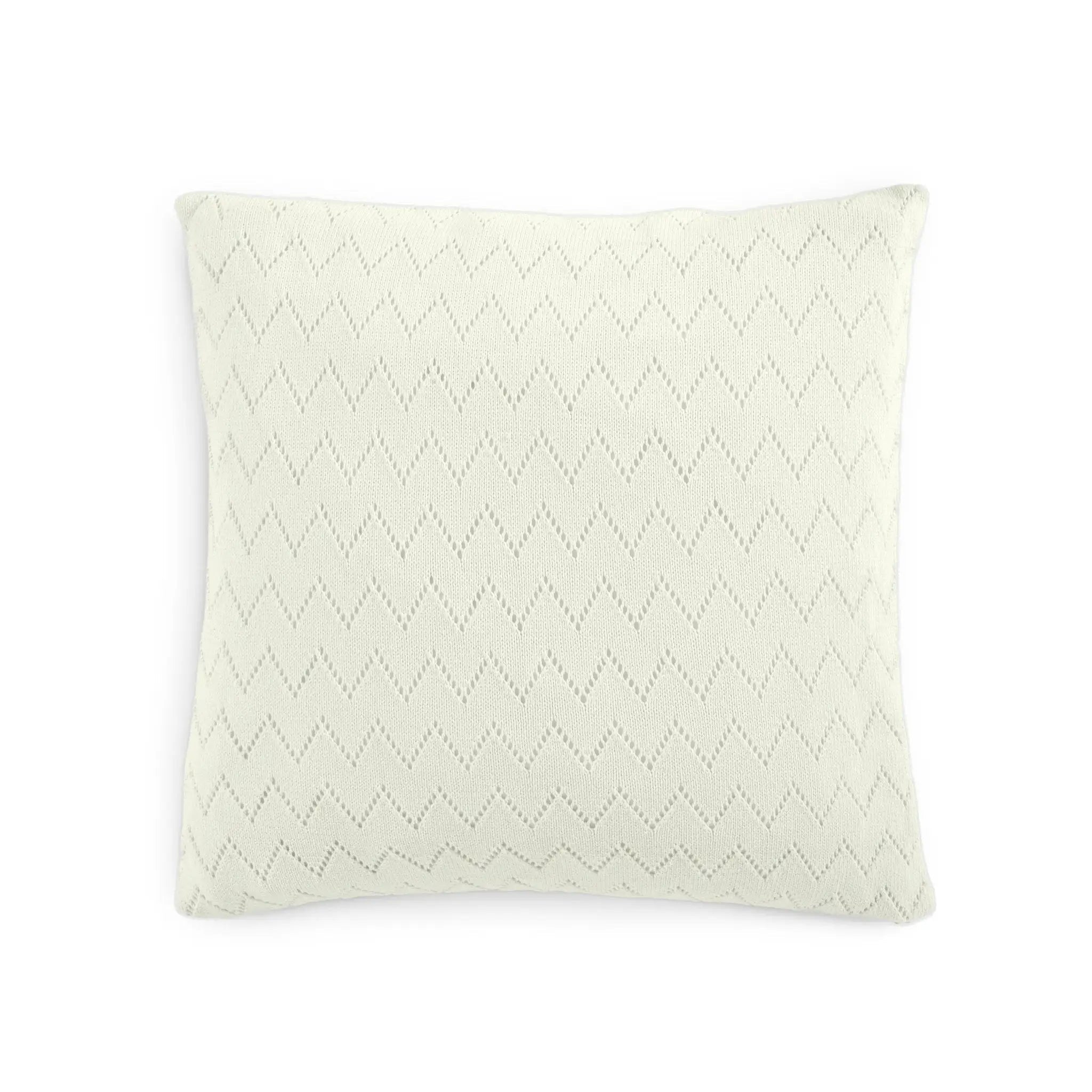 A square throw pillow in a warm off-white or cream color, featuring a subtle, tonal dotted chevron pattern across the front, set against a plain white background.