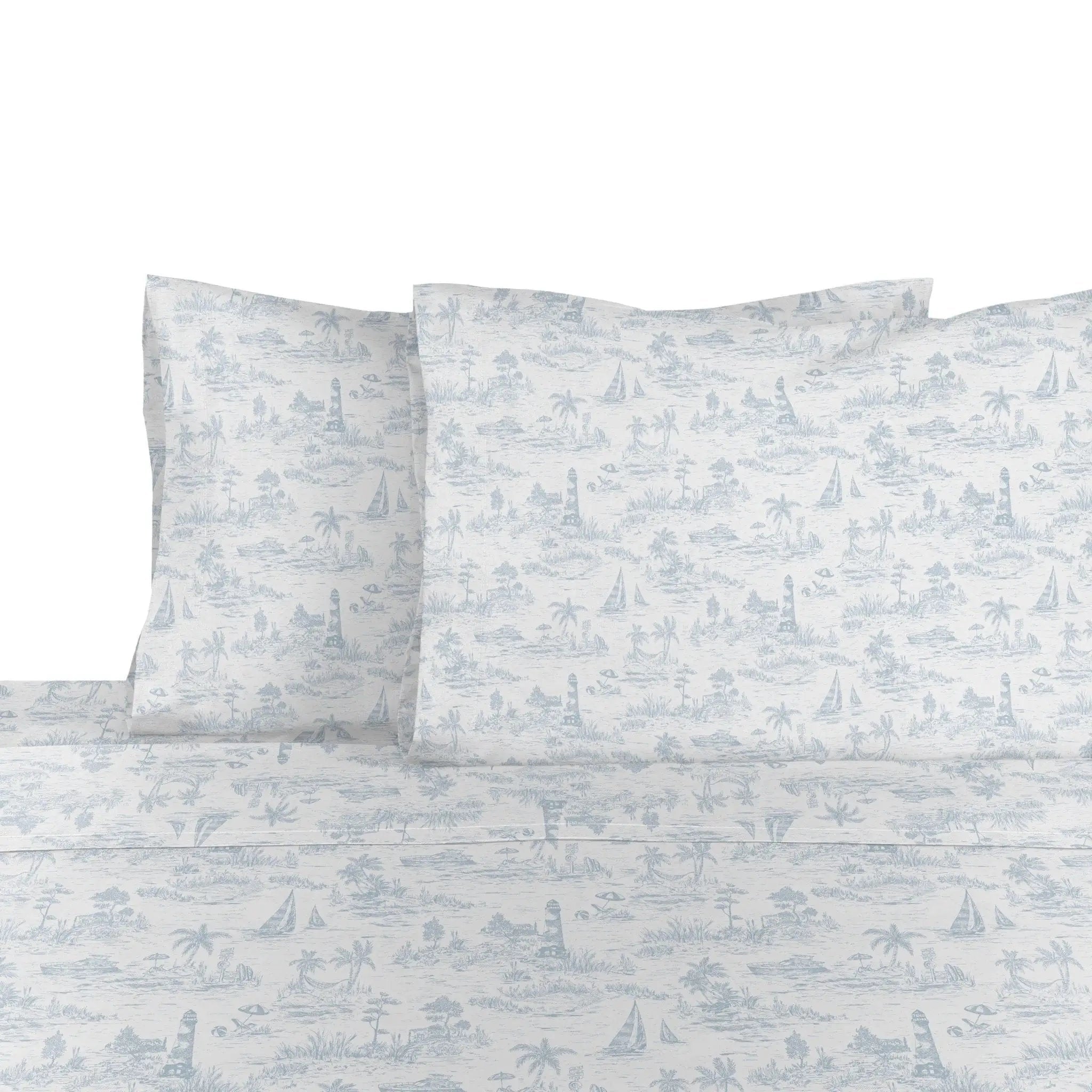 White sheet and pillowcase set with a light blue toile de Jouy pattern featuring palm trees, sailboats, and lighthouses.