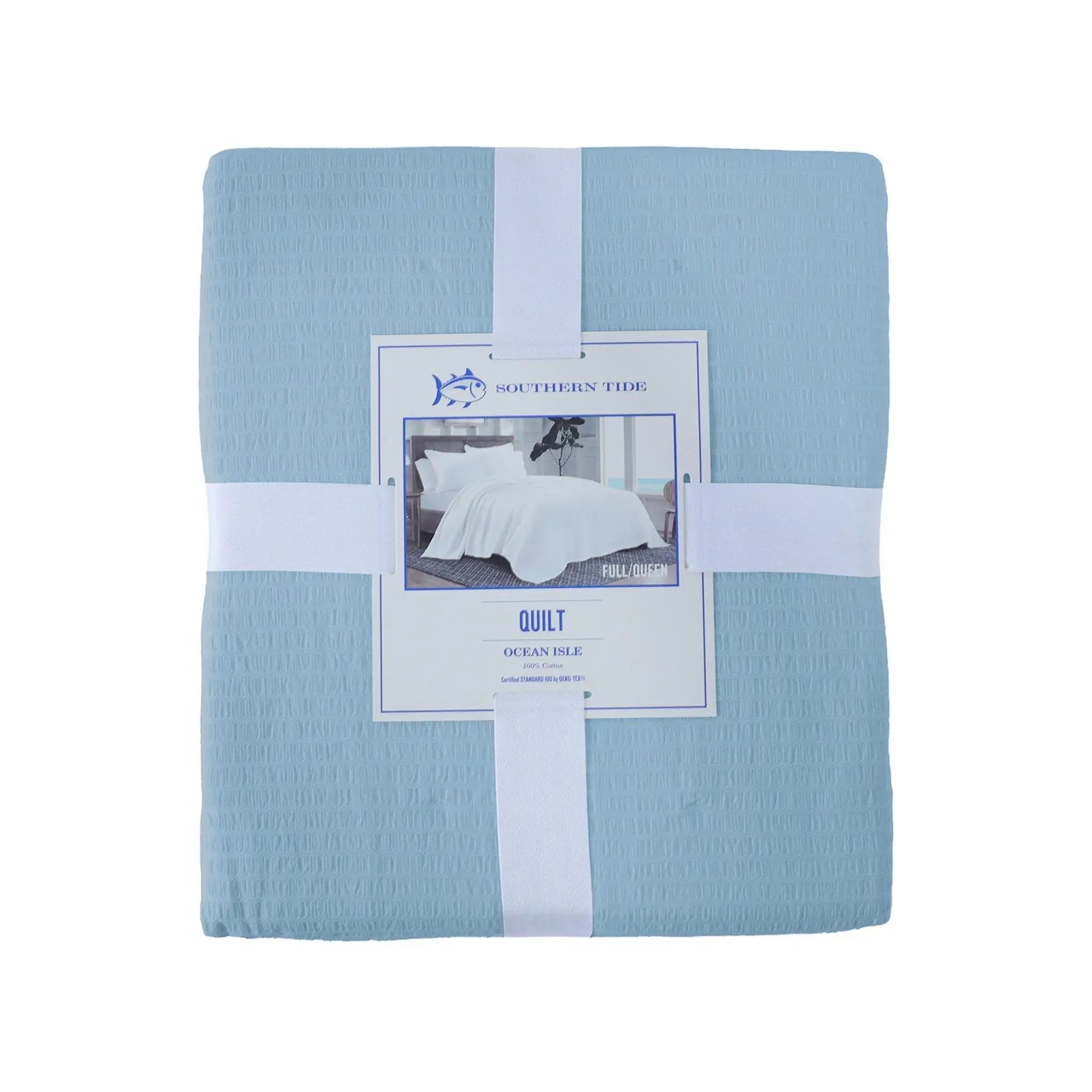 Blue quilt with packaging on a white background