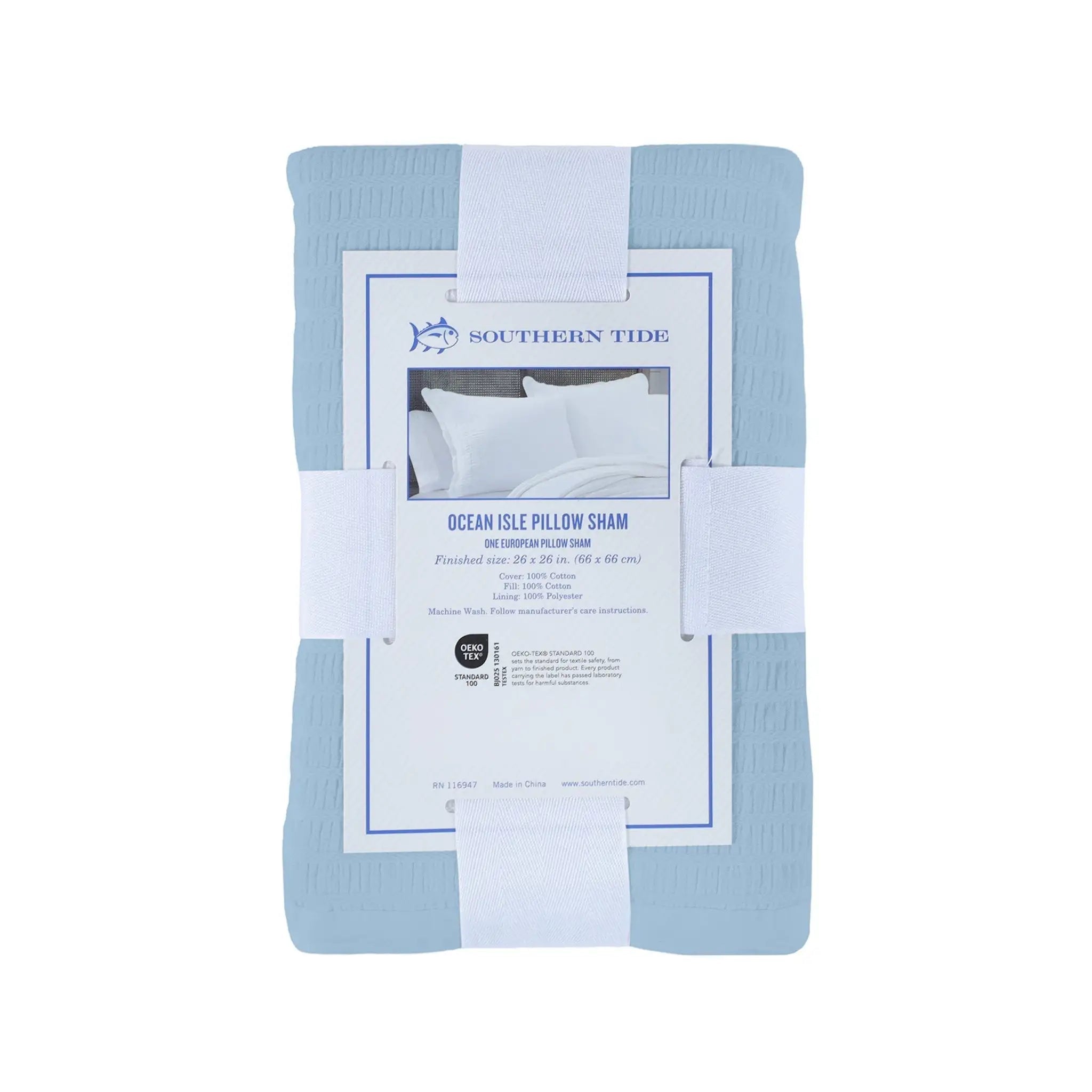 A folded light blue pillow sham wrapped in a white paper band with a white paper label. The label shows the brand 'Southern Tide' and the product name 'Ocean Isle Pillow Sham'.