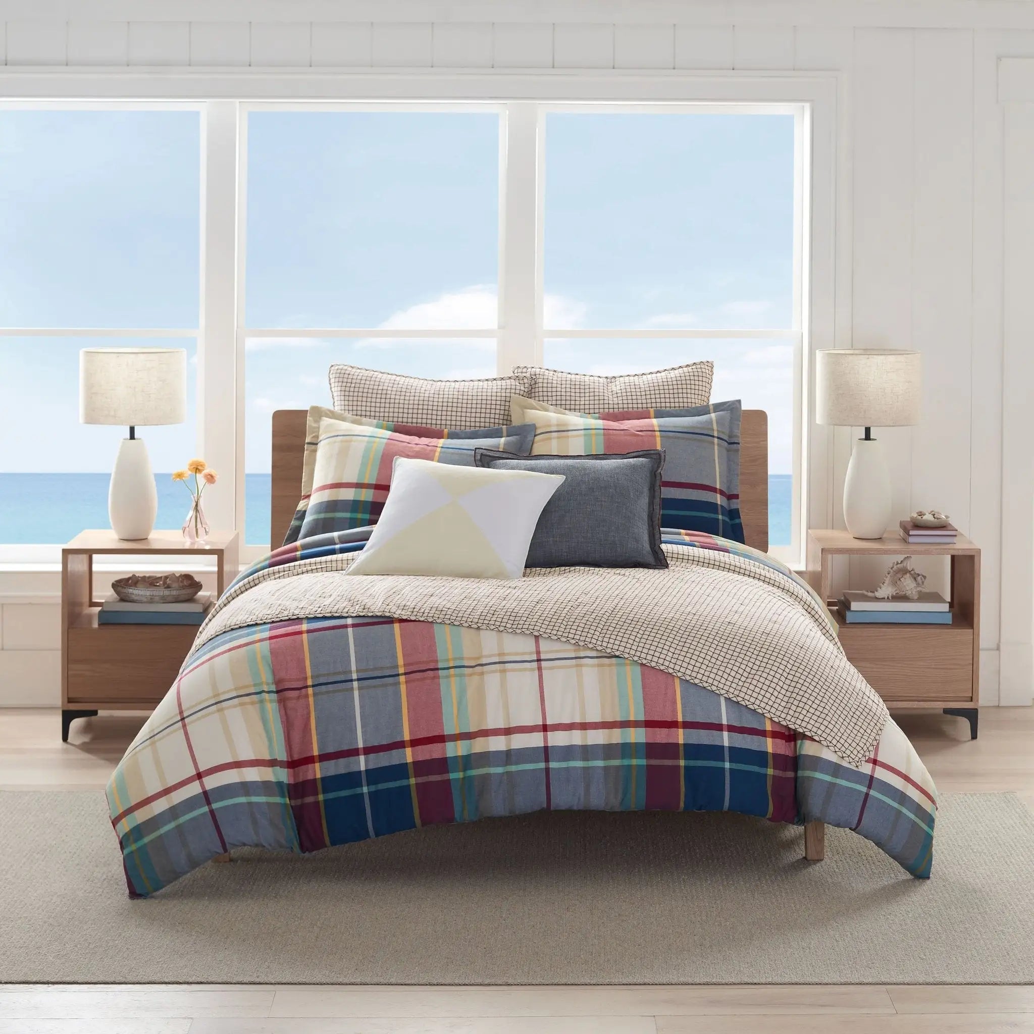 Bedroom with plaid comforter bedding set.