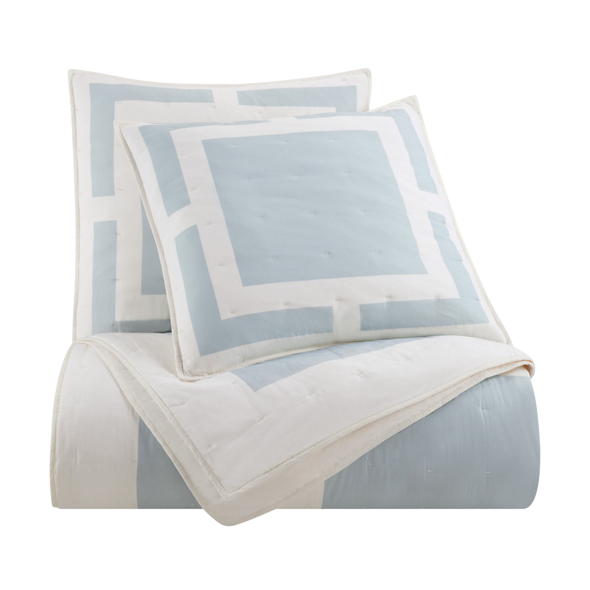Light blue and white quilt and euro on a white background