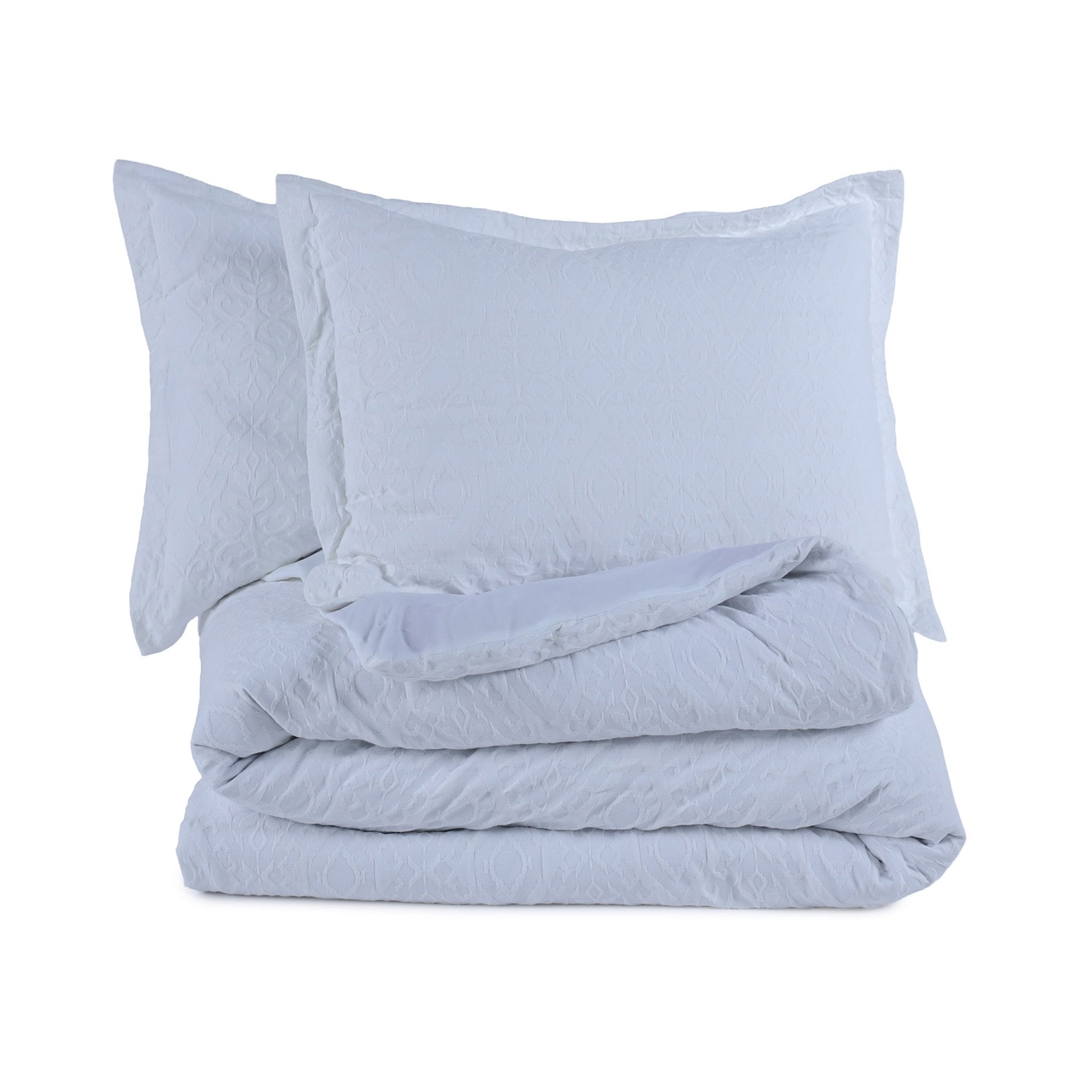 White comforter set on a white background
