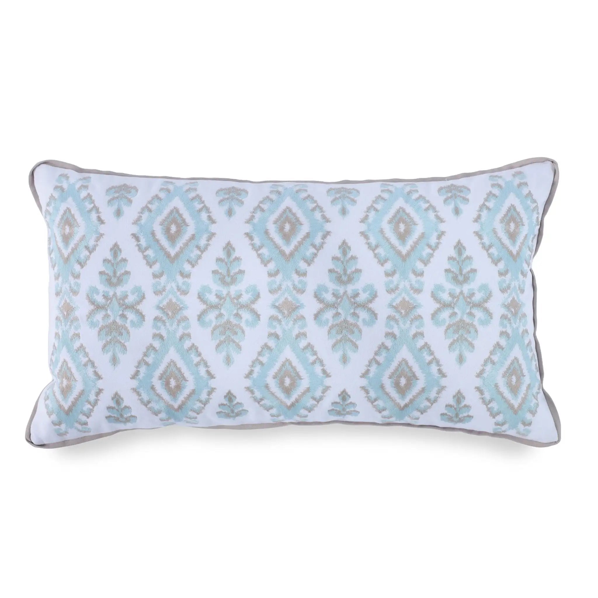 A rectangular lumbar throw pillow featuring a light blue and beige ikat diamond pattern on a white background, finished with a gray piped edge.