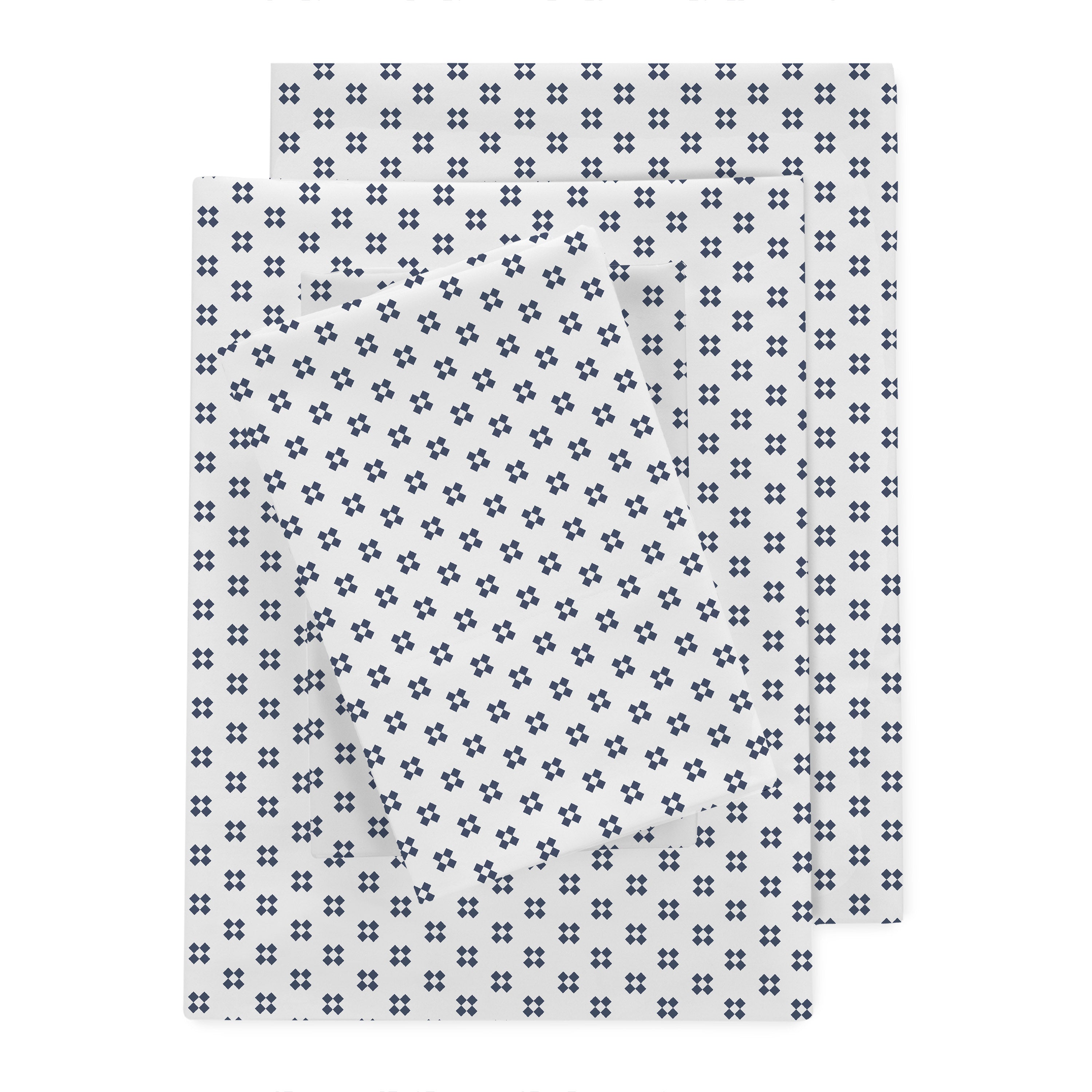 Percale sheet set featuring a white background with a navy blue floral pattern.