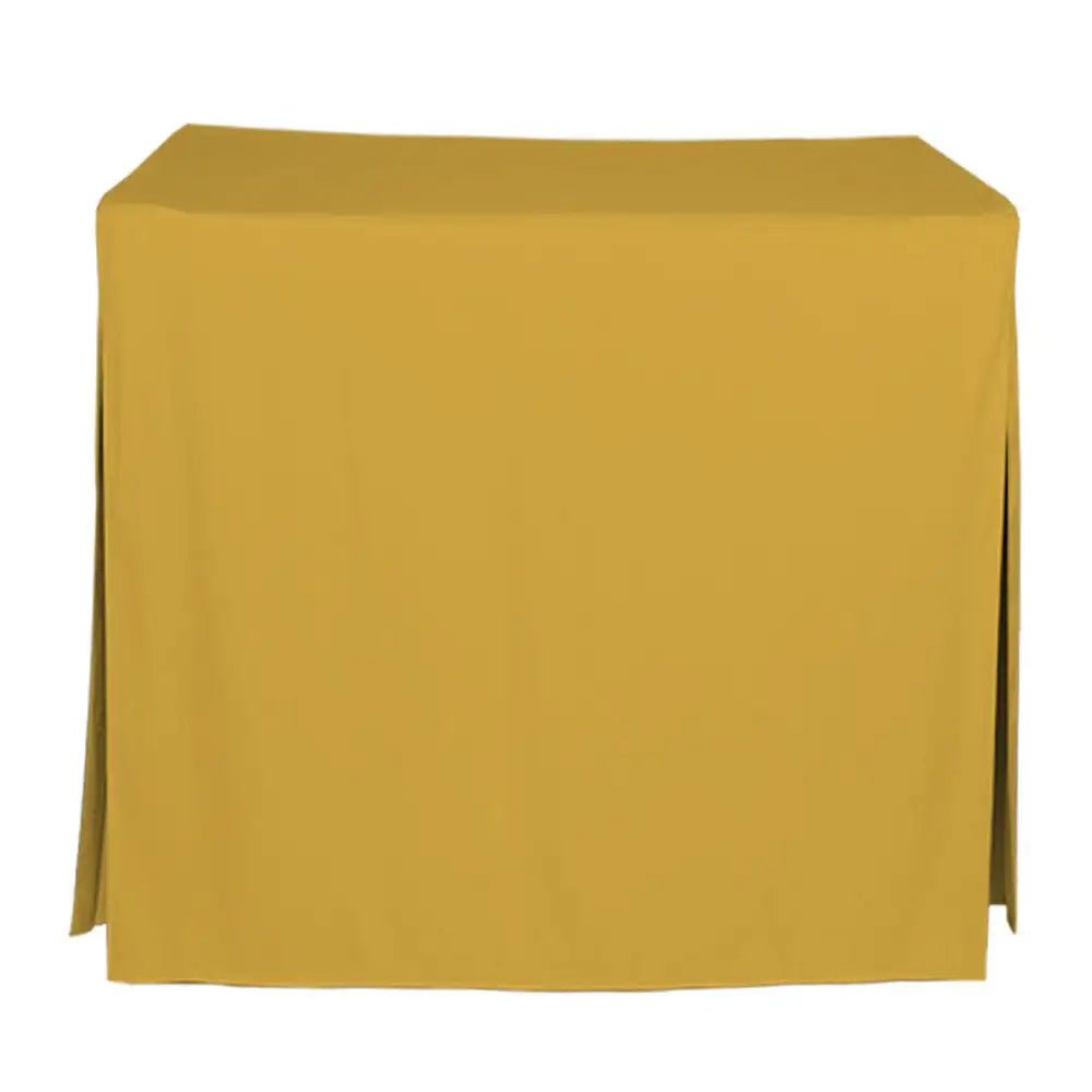 A mustard yellow tablecloth draped over a rectangular table, shown against a plain white background.