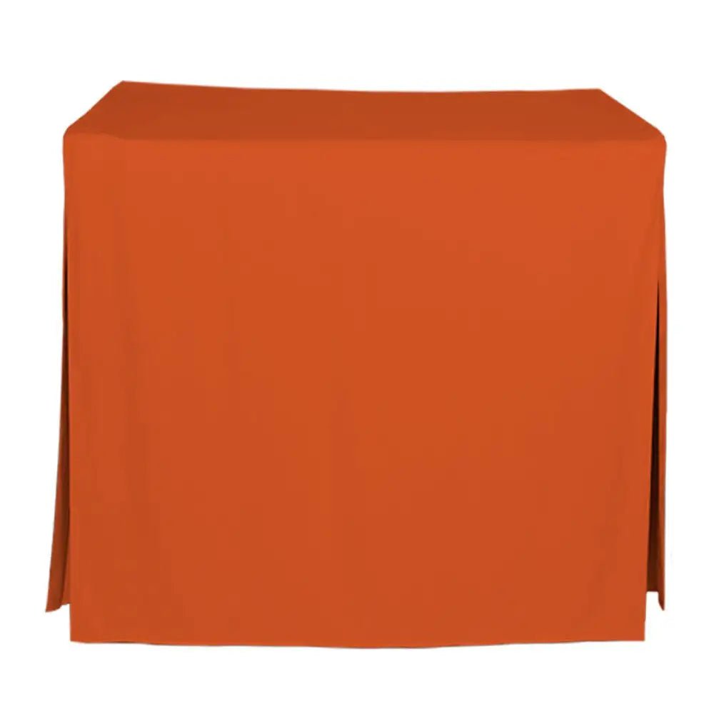 An orange tablecloth draped over a rectangular table, shown against a plain white background.
